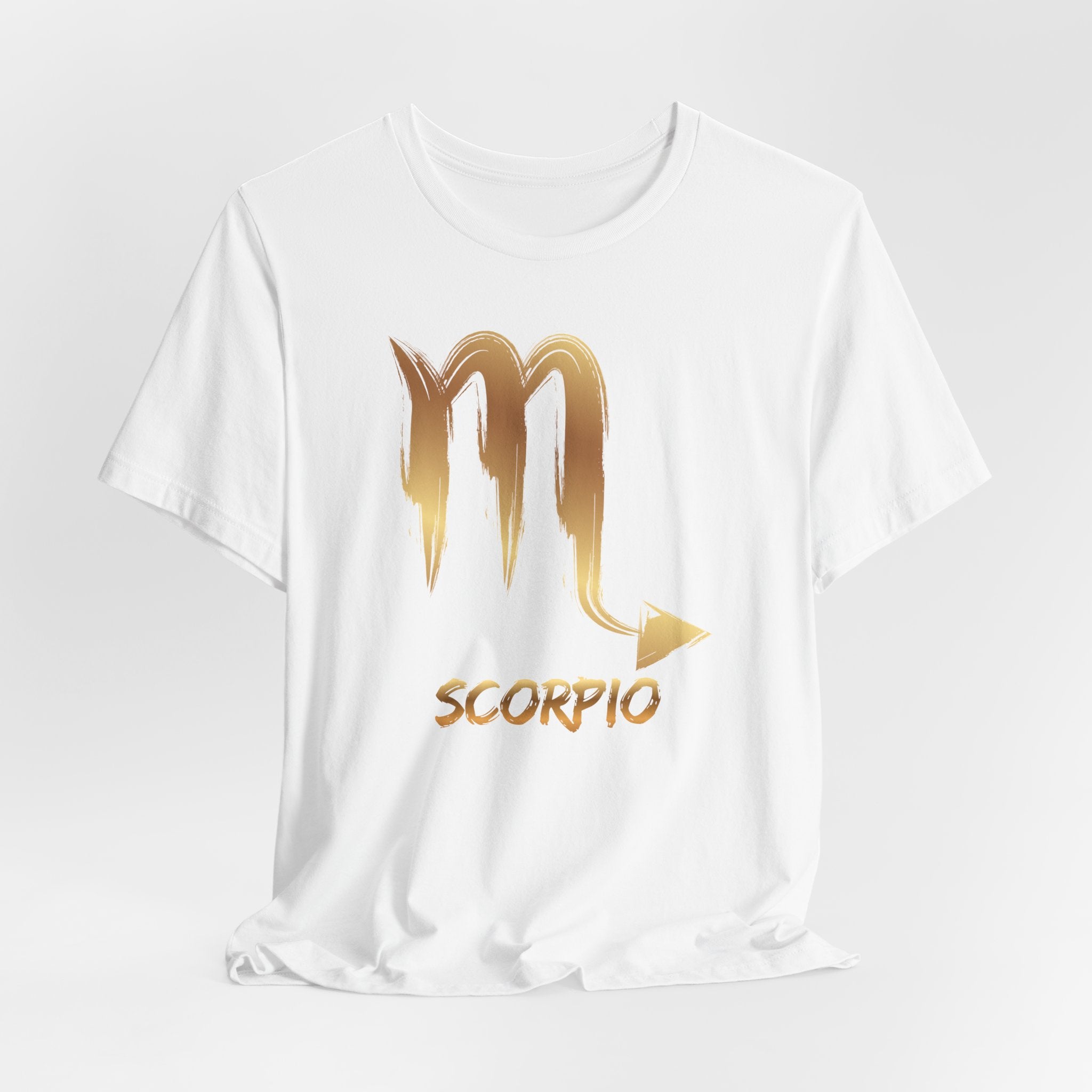 White t-shirt with gold Scorpio zodiac symbol on a white background