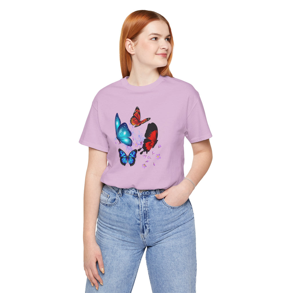 Person wearing a purple t-shirt with butterfly designs on a white background