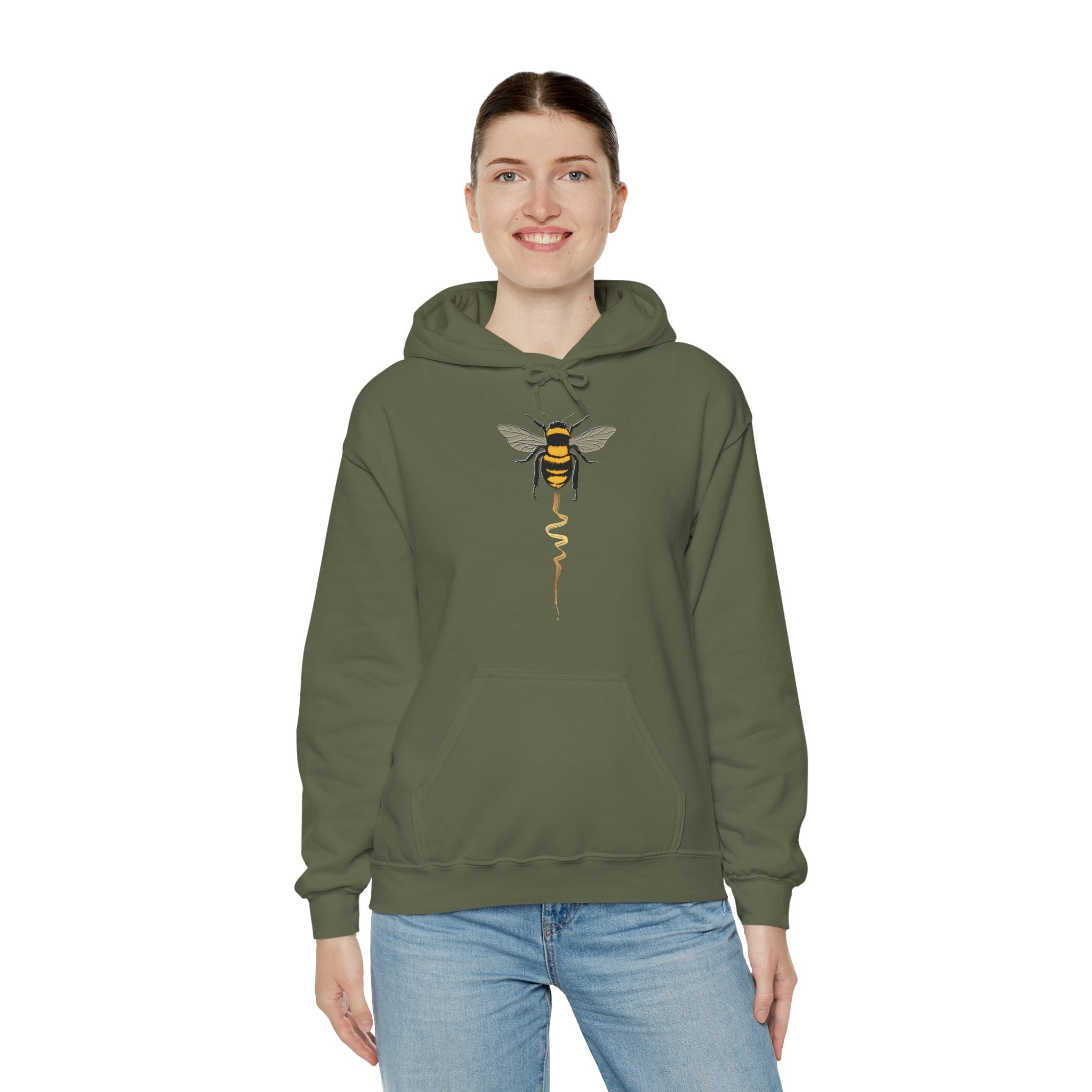 Person wearing a green hoodie with a bee design on a white background