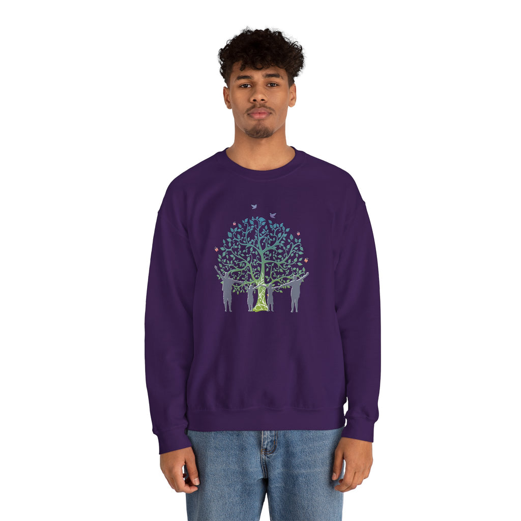 Person wearing a purple sweatshirt with a tree and people design on a white background