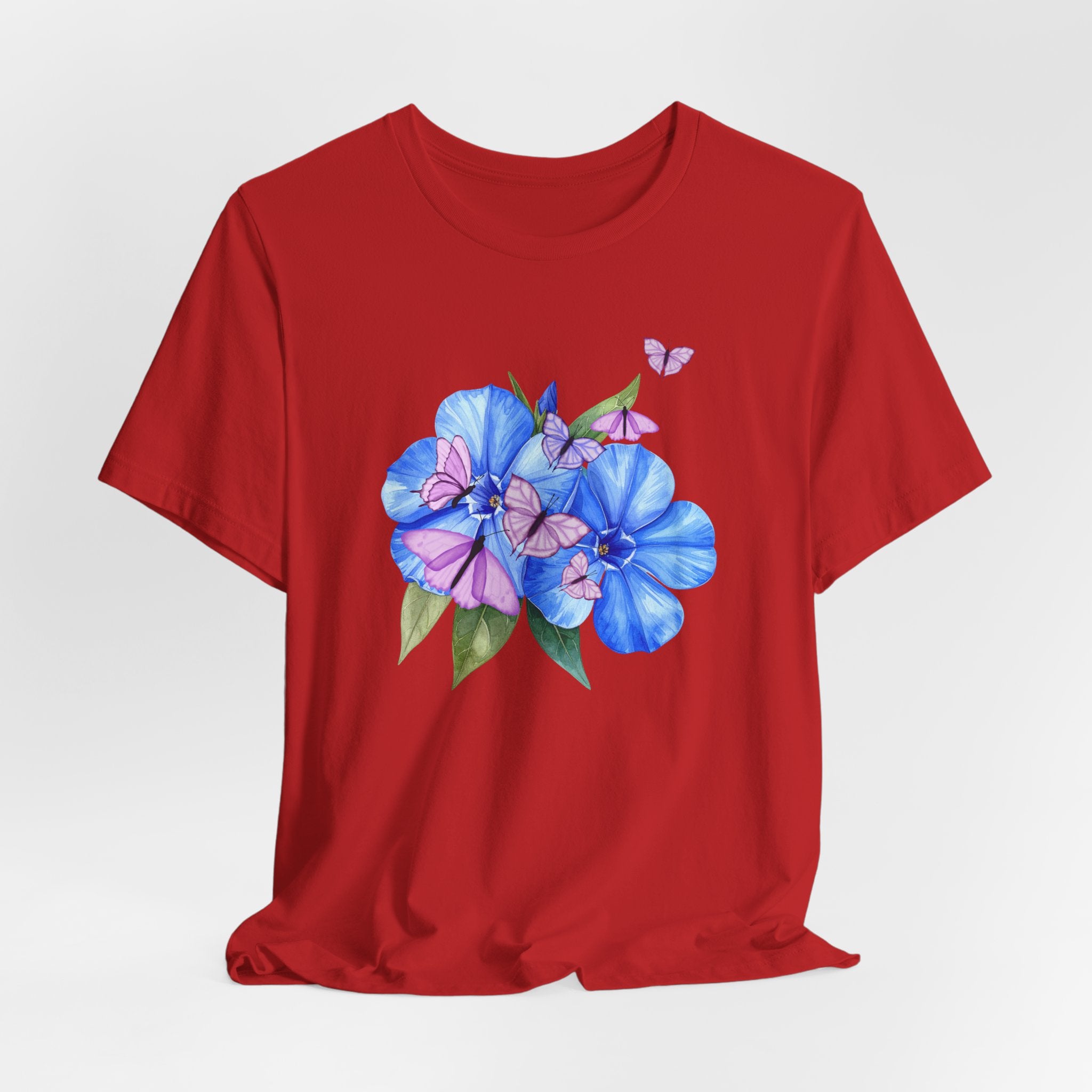 Red t-shirt with blue floral design on a white background