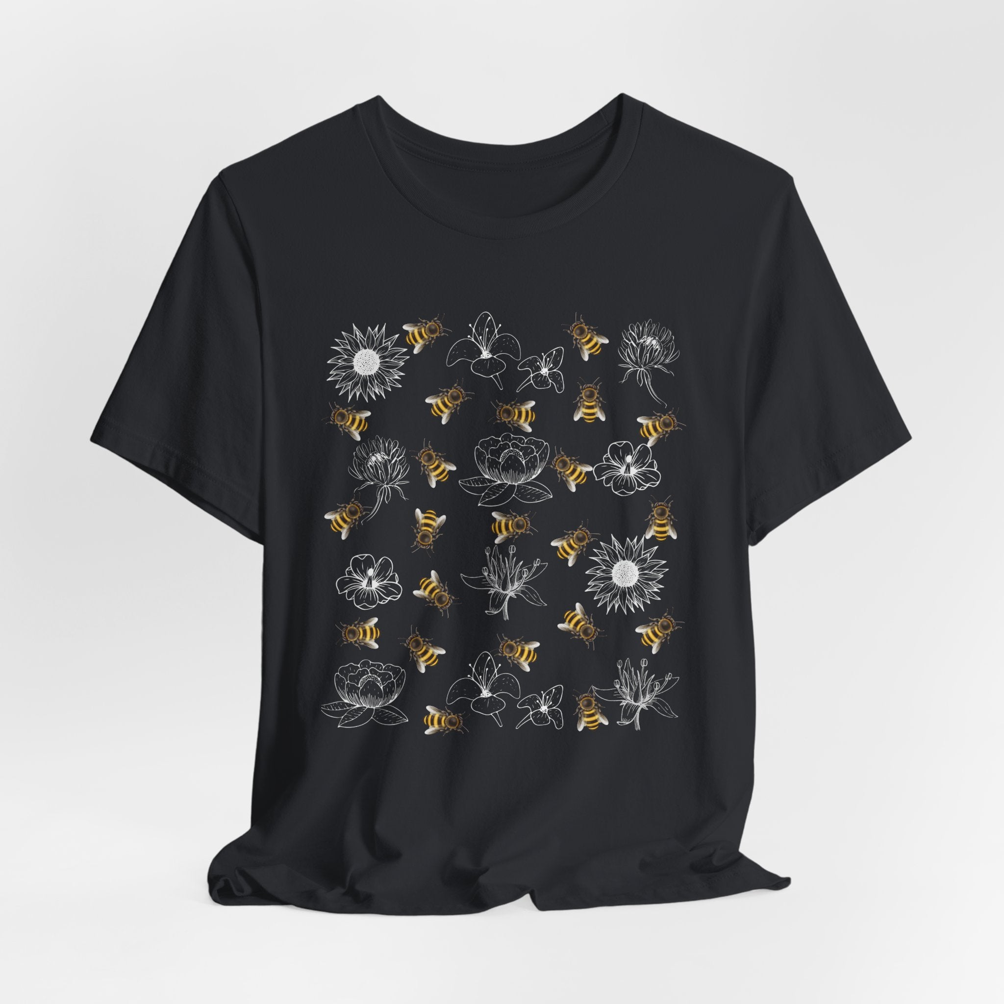 Black t-shirt with bee and flower on a white background