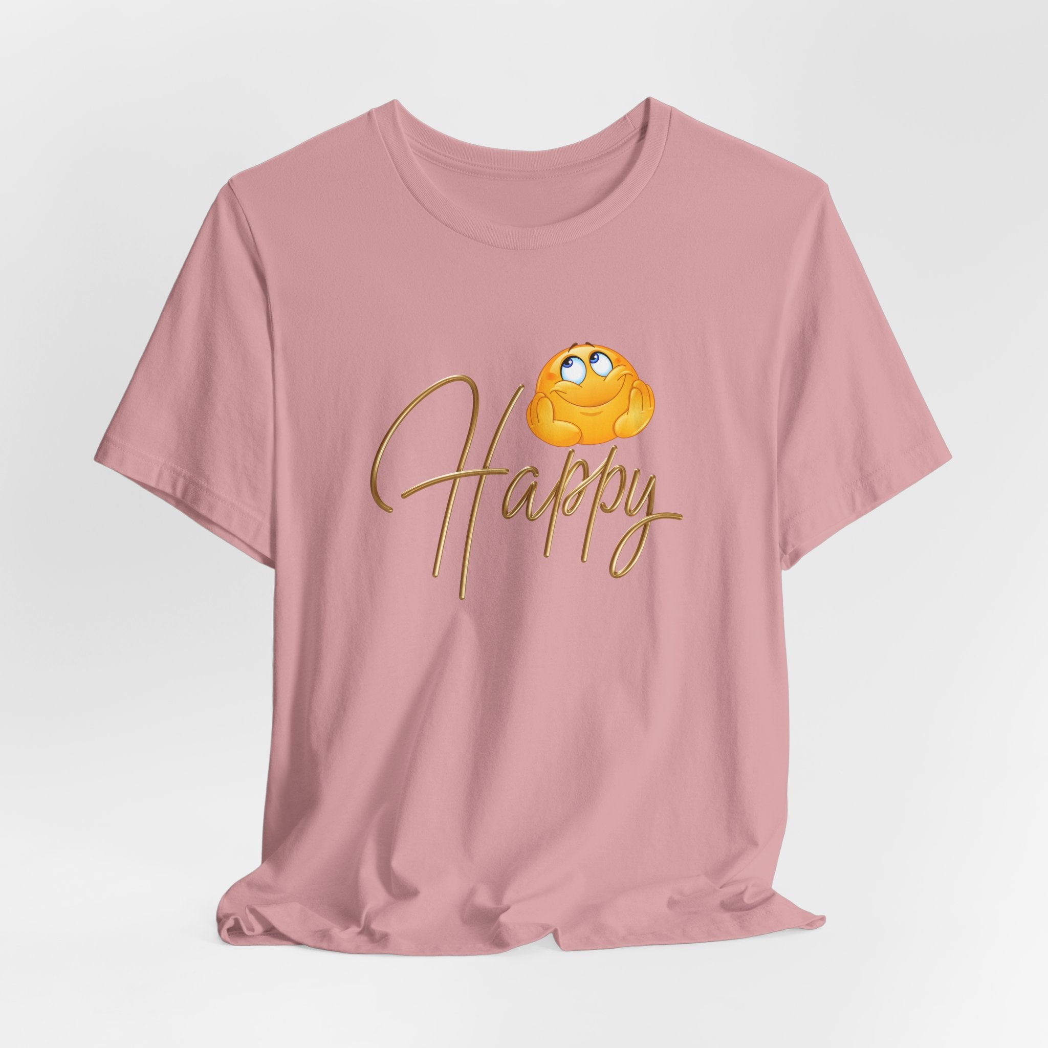 Pink t-shirt with a cartoon face and 'Happy' text on a light gray background