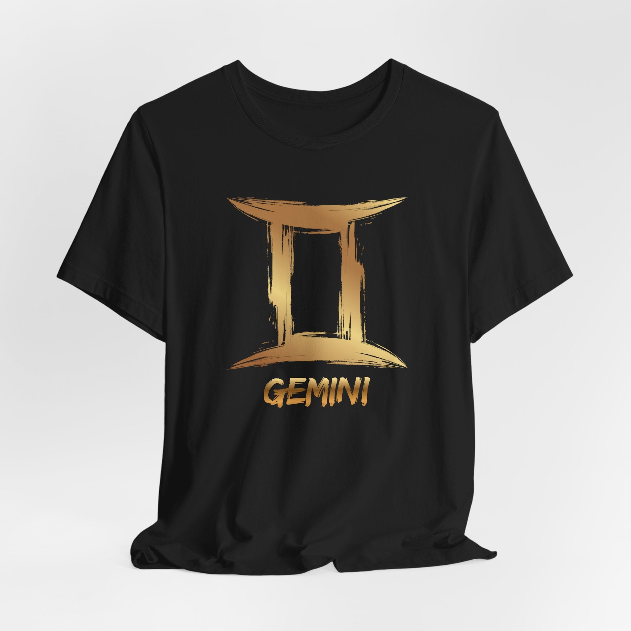 Black t-shirt with gold Gemini zodiac sign design on a white background