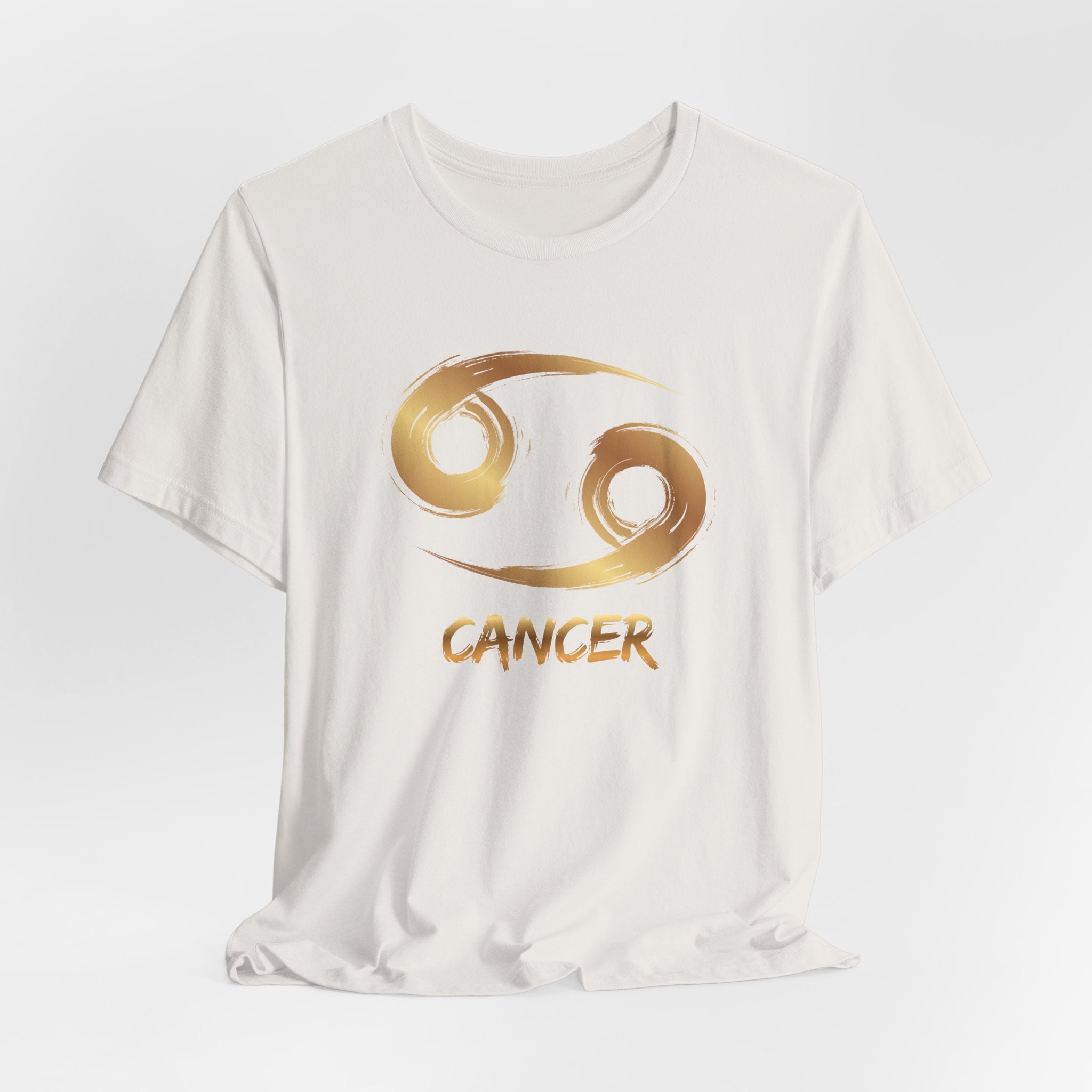 White t-shirt with gold Cancer zodiac symbol on a white background