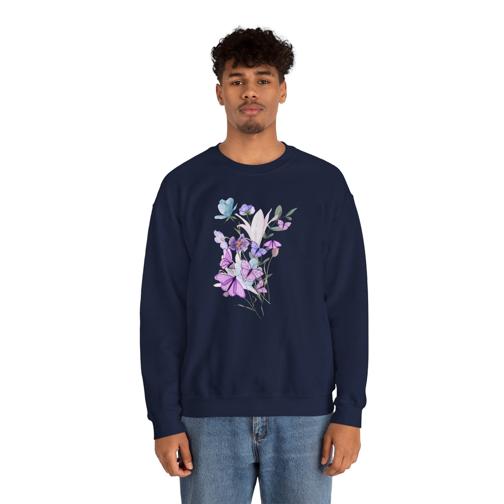 Person wearing a navy blue sweatshirt with floral design on a white background