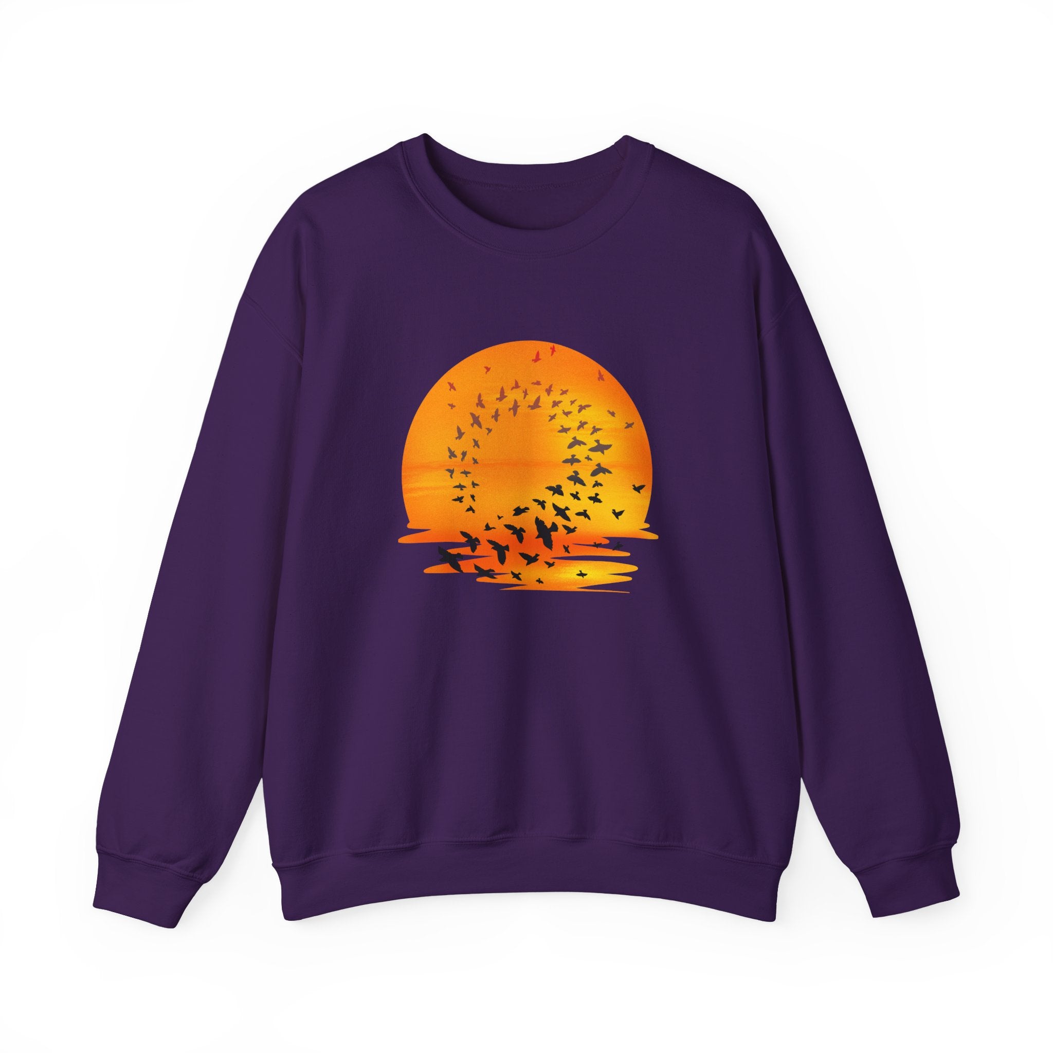 Purple sweatshirt with an orange sunset and bird design on a white background