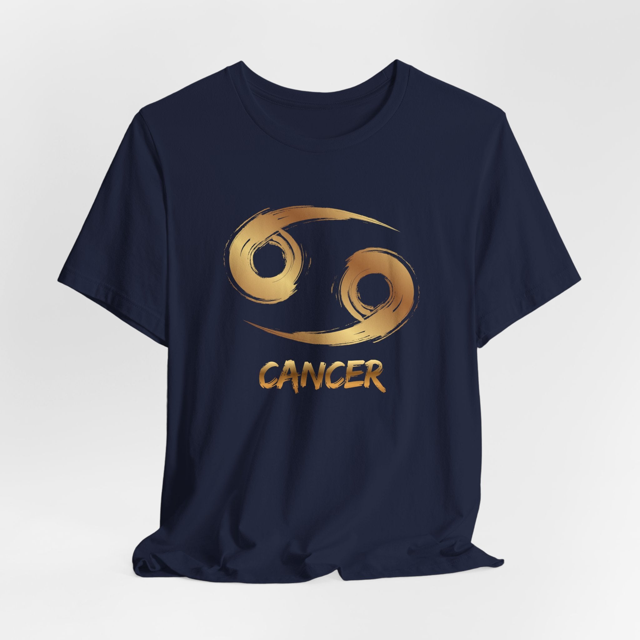 Navy blue t-shirt with gold Cancer zodiac symbol on a light gray background
