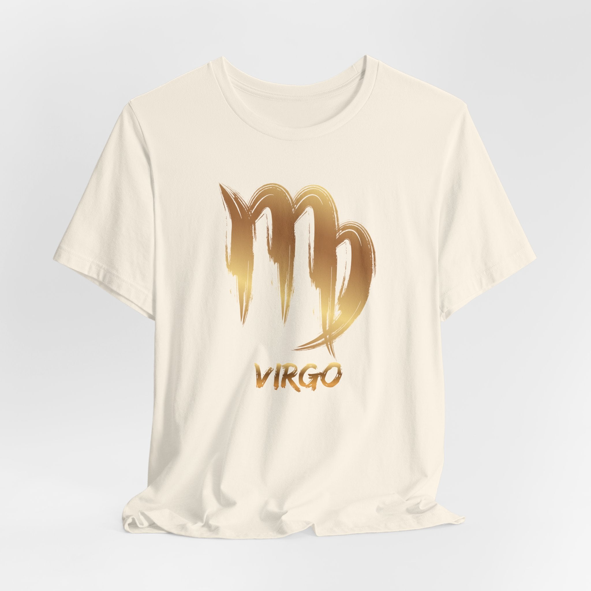 White t-shirt with gold 'Virgo' design on a light gray background