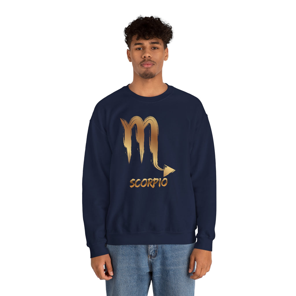Person wearing a navy blue sweatshirt with a gold Scorpio symbol design on a white background