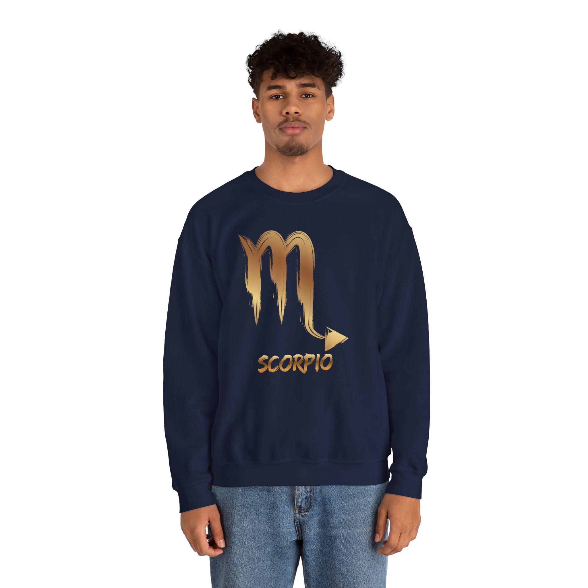 Person wearing a navy blue sweatshirt with a gold Scorpio symbol design on a white background