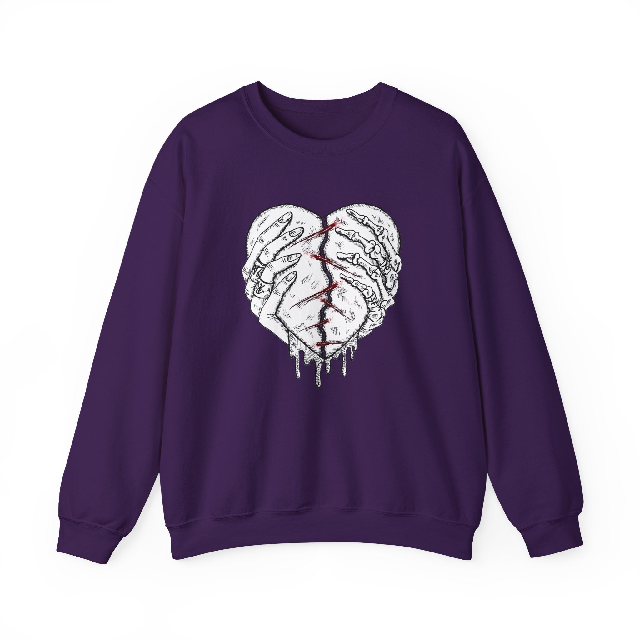 Purple sweatshirt with a graphic design of a broken heart on a white background