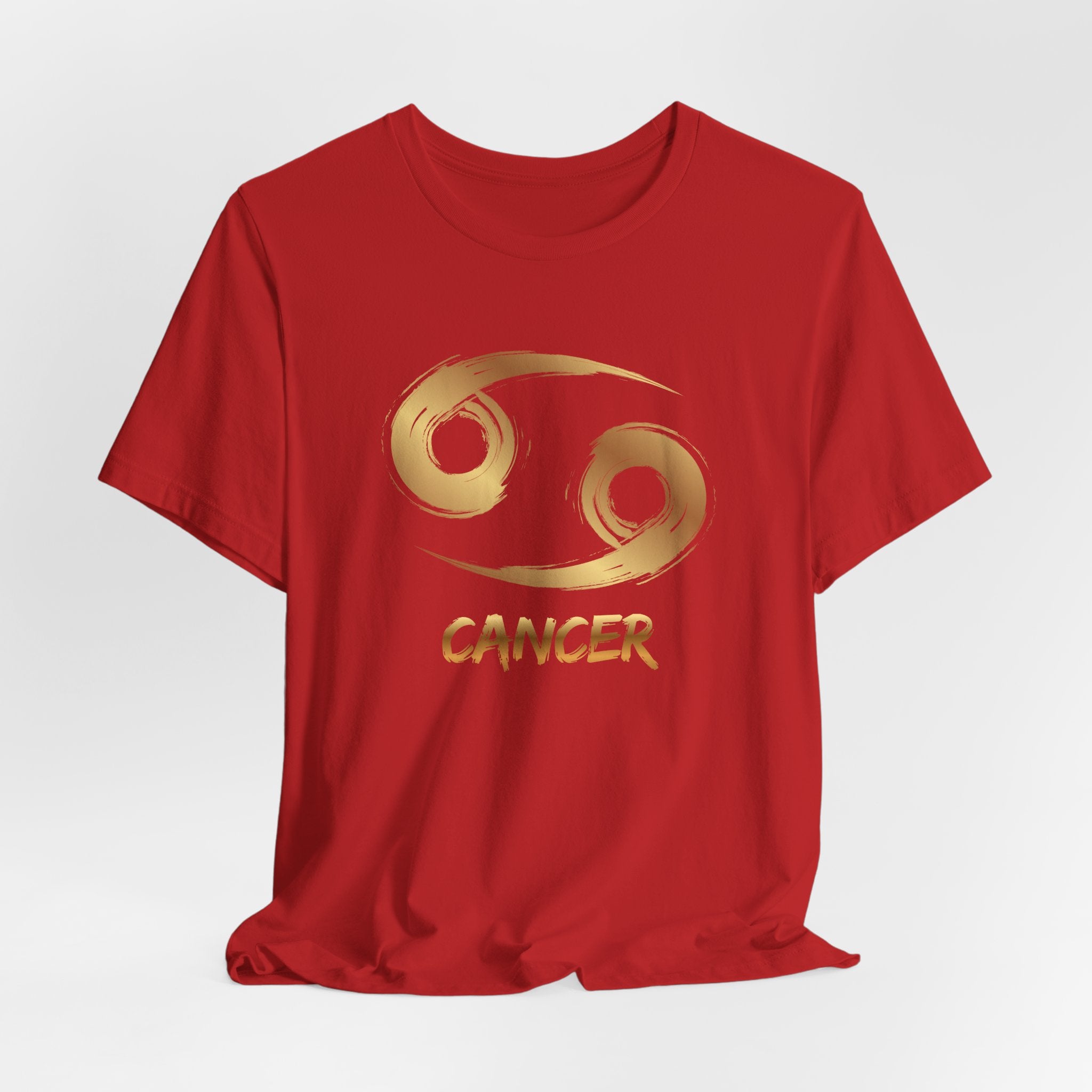 Red t-shirt with gold Cancer zodiac symbol on a white background
