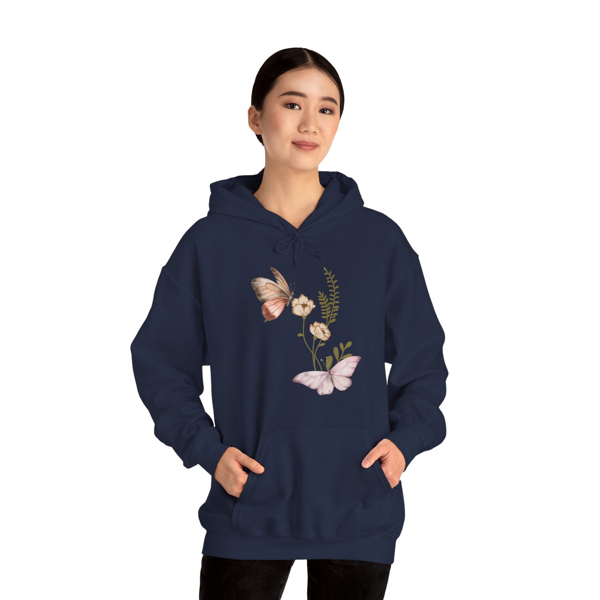 Person wearing a navy blue hoodie with butterfly design on a white background