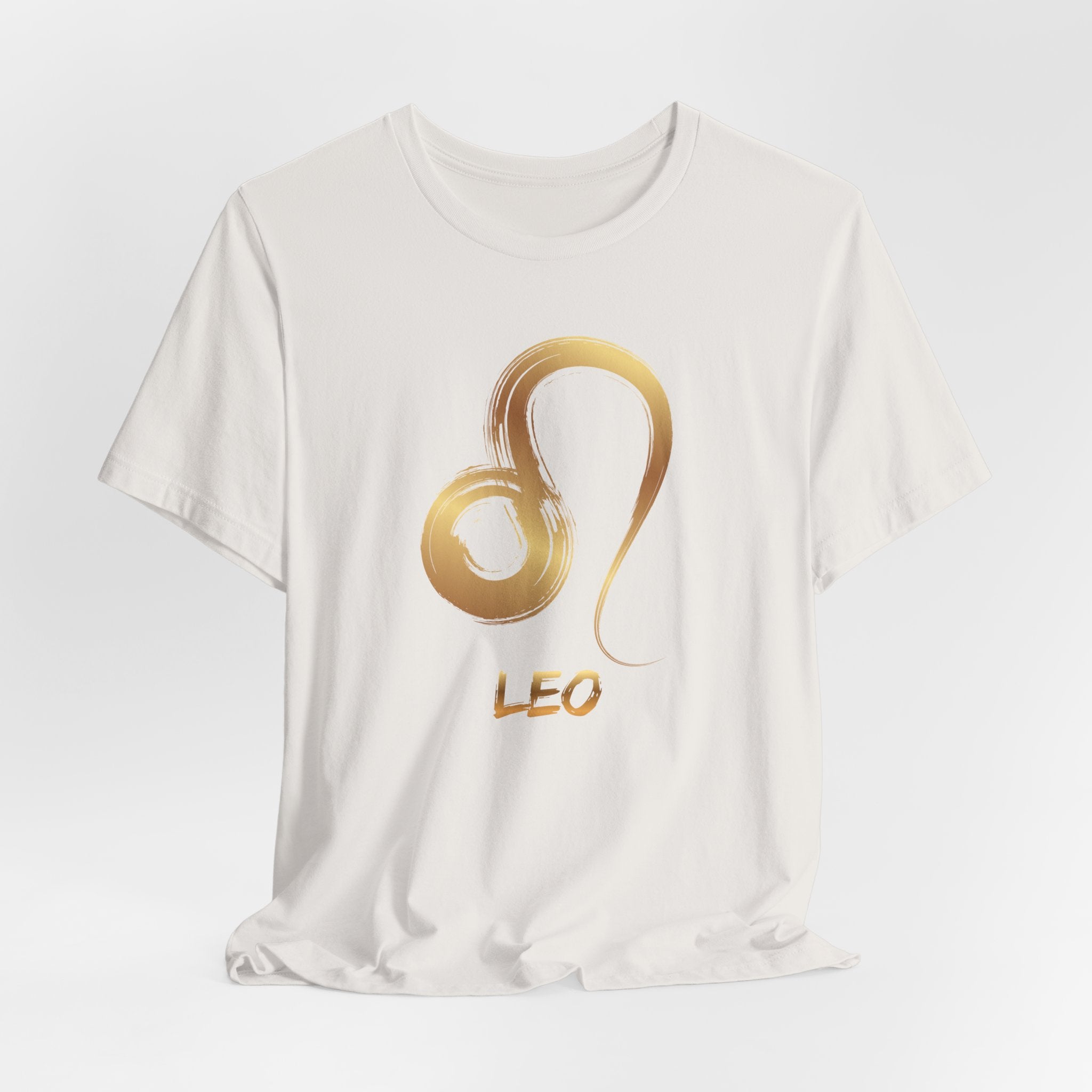 White t-shirt with a gold Leo zodiac symbol on a white background