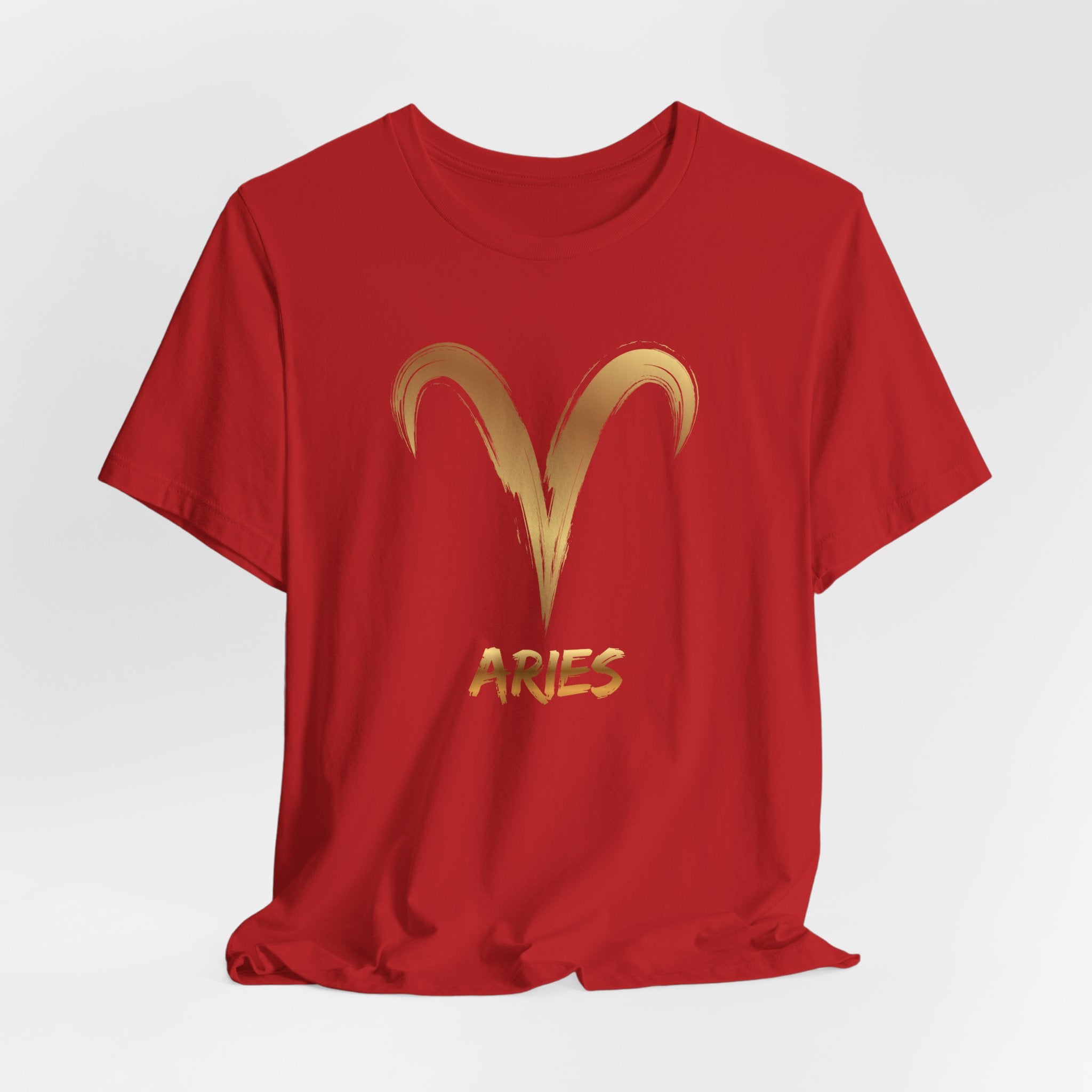 Red t-shirt with gold Aries symbol and text on a white background