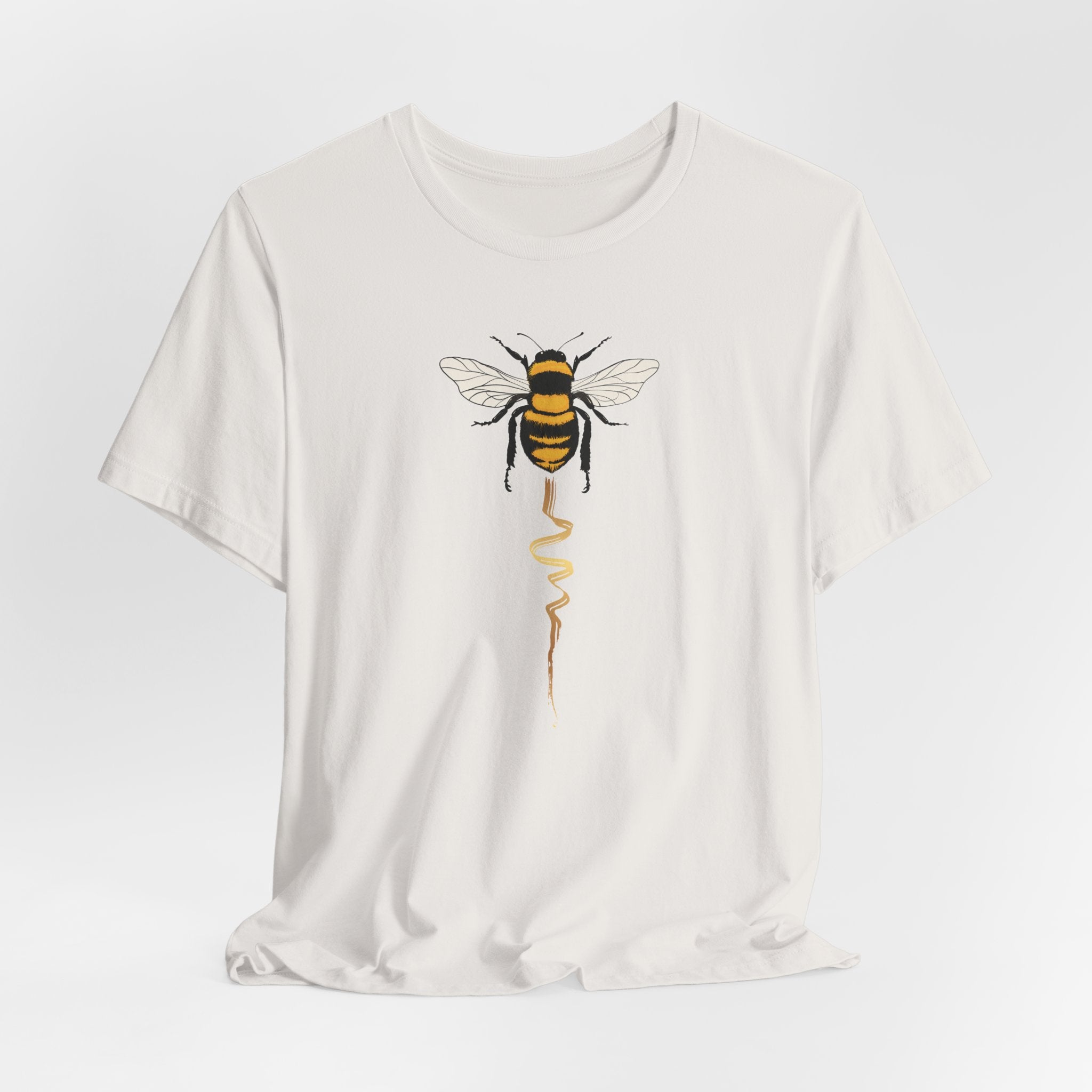 White t-shirt with a bee graphic on a white background