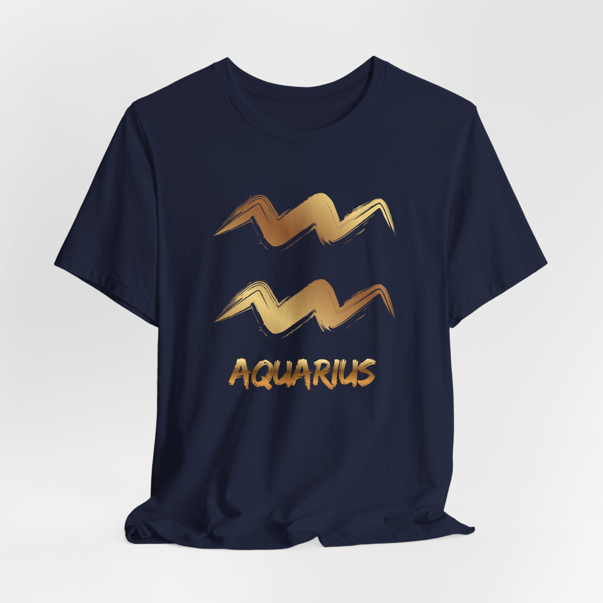 Navy blue t-shirt with gold Aquarius zodiac design on a light gray background