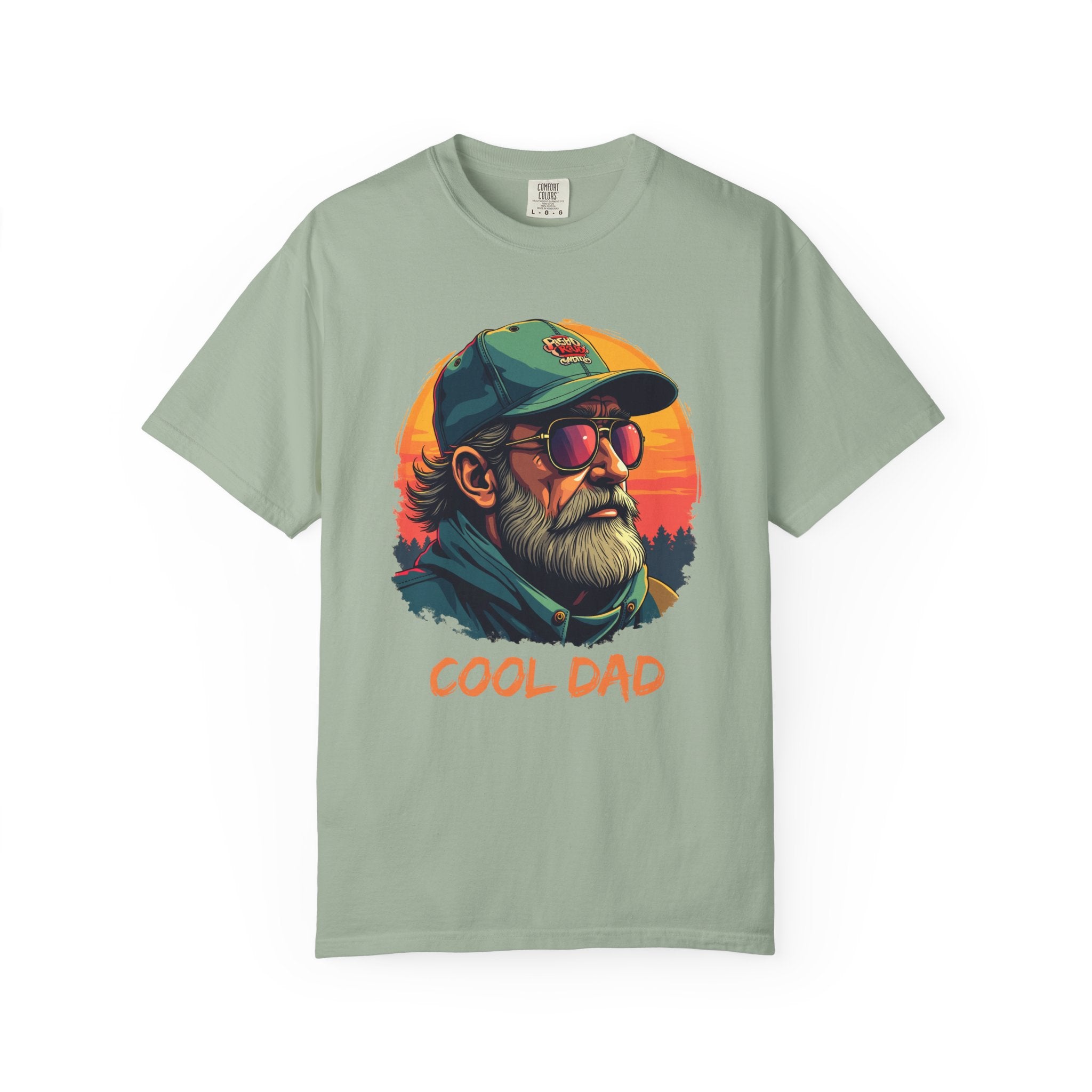 Light green t-shirt with 'Cool Dad' graphic design featuring a man with sunglasses and a cap on a white background