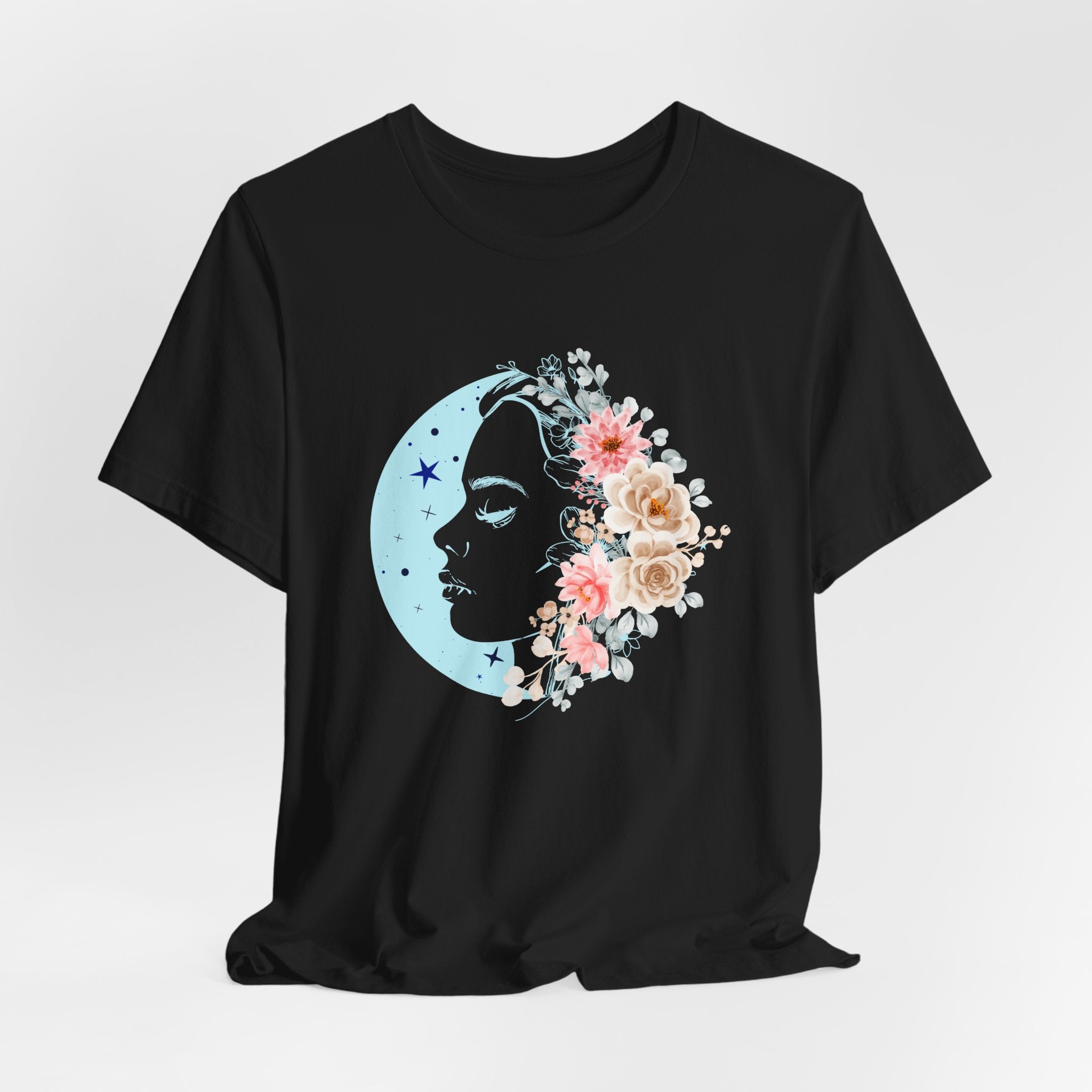 Black t-shirt with a floral moon and silhouette design on a white background