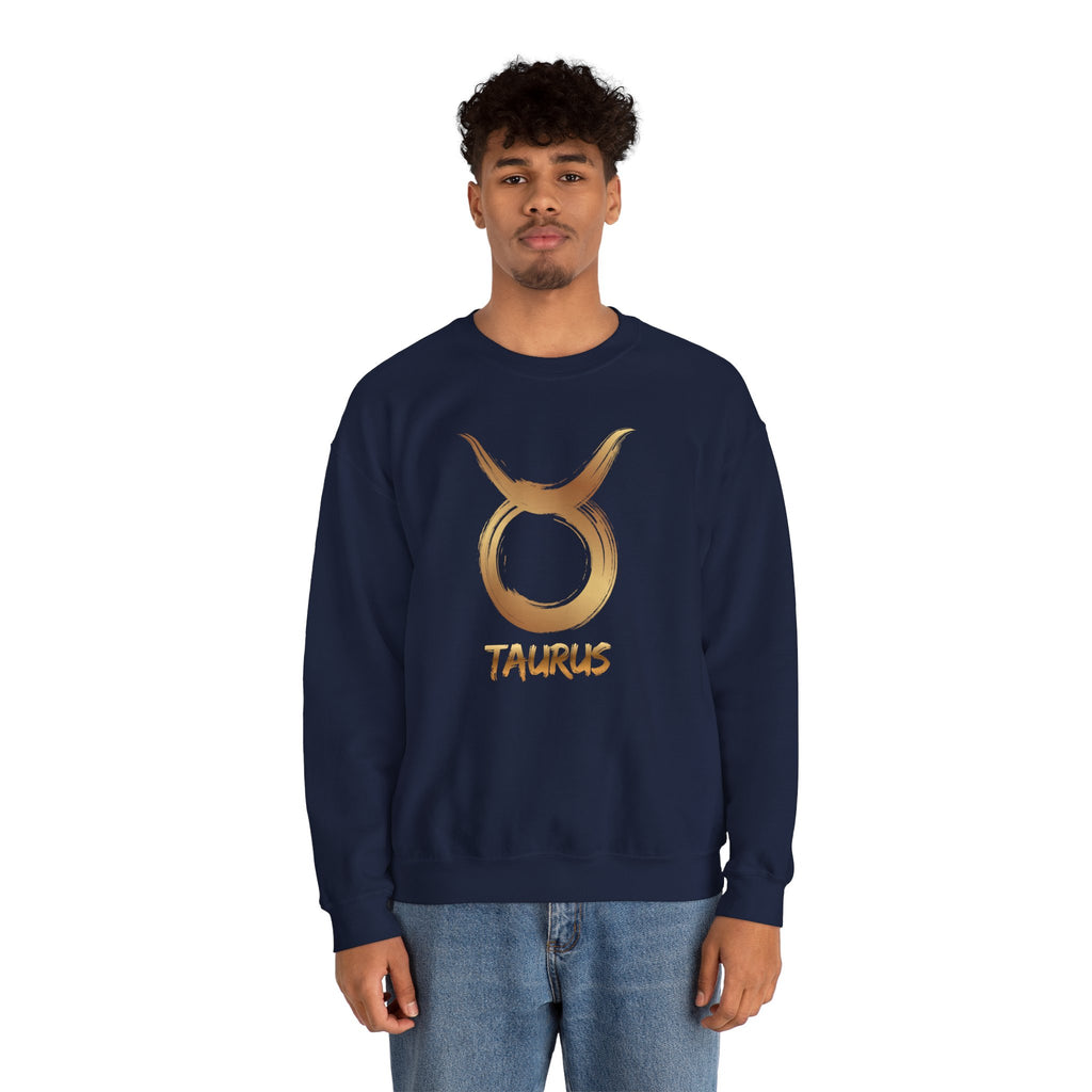 Person wearing a navy blue sweatshirt with a gold Taurus symbol on a white background