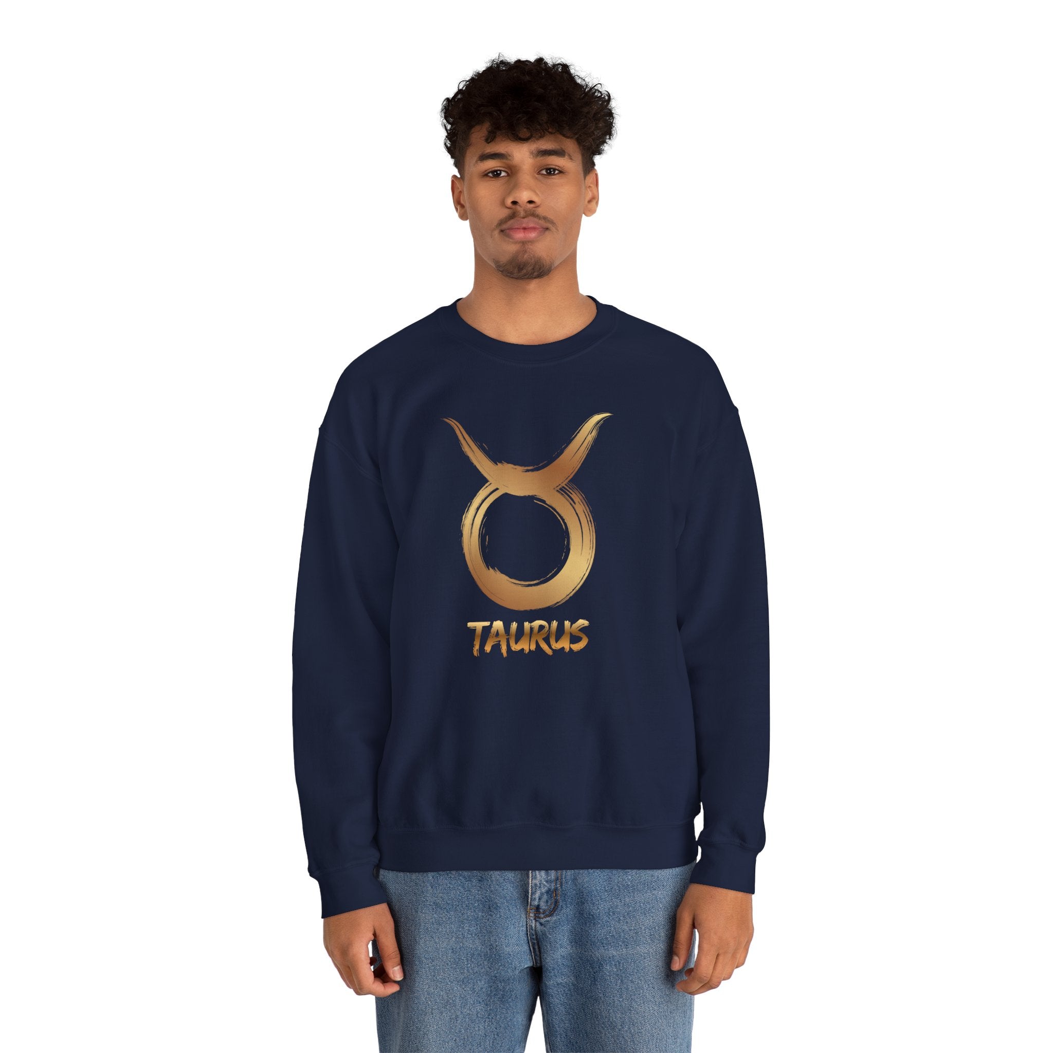 Person wearing a navy blue sweatshirt with a gold Taurus symbol on a white background