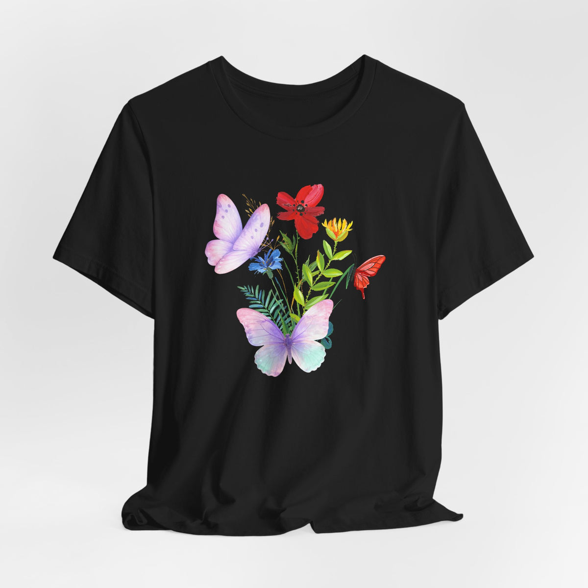Black t-shirt with colorful butterfly and flower design on a white background