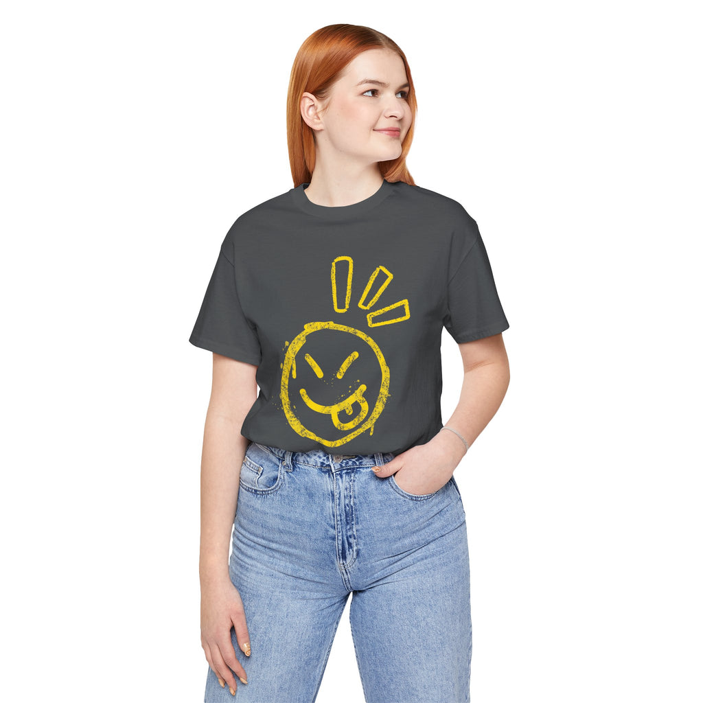 Person wearing a dark gray t-shirt with a yellow smiley face design on a white background