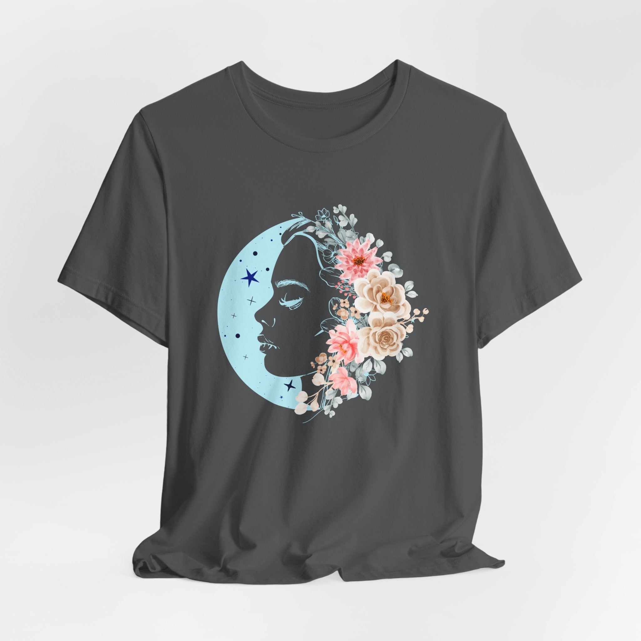 Black t-shirt with a floral moon and face design on a light gray background