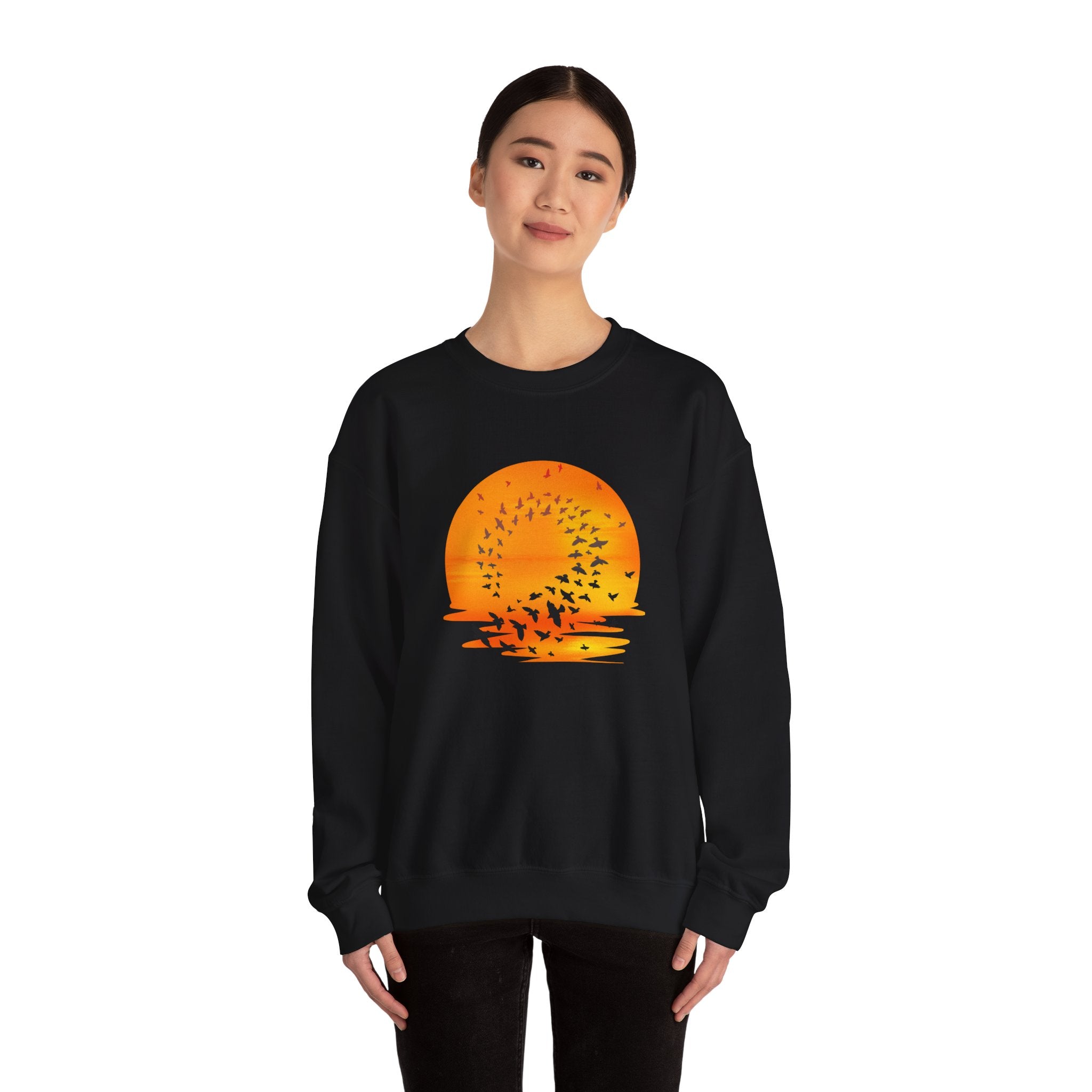 Black sweatshirt with a sunset design on a white background