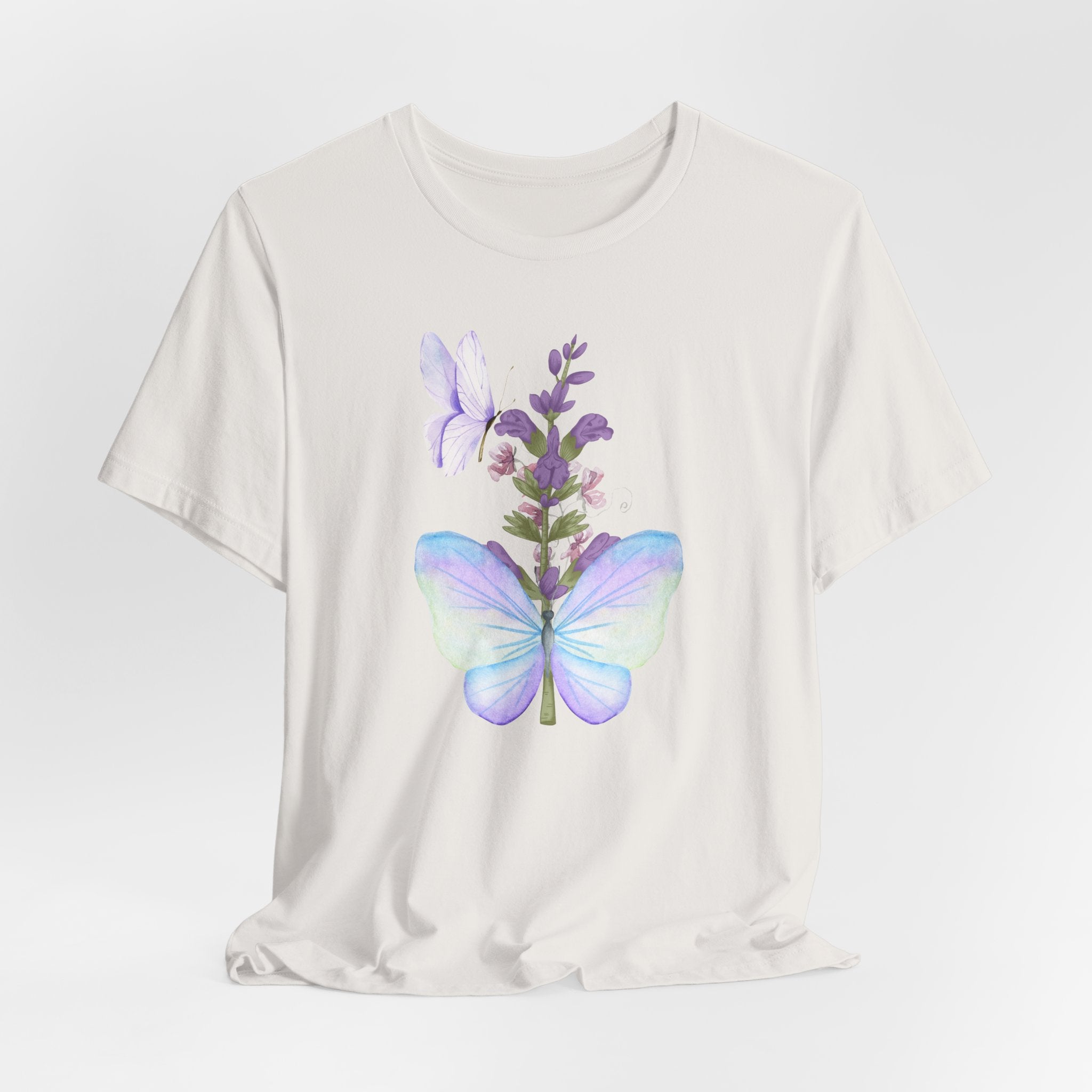 White t-shirt with a colorful butterfly and flower design on a white background