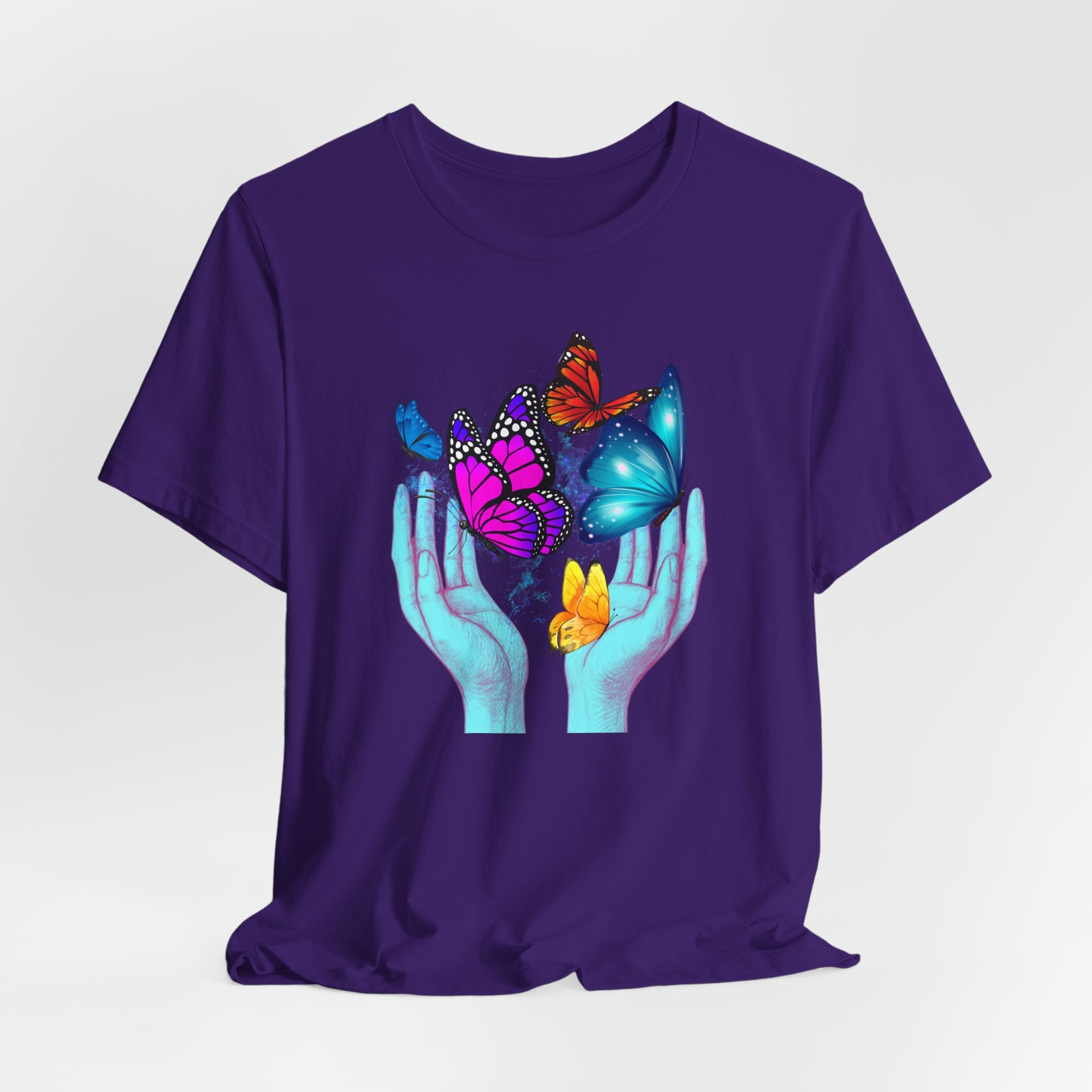 Purple t-shirt with colorful butterfly design on a white background