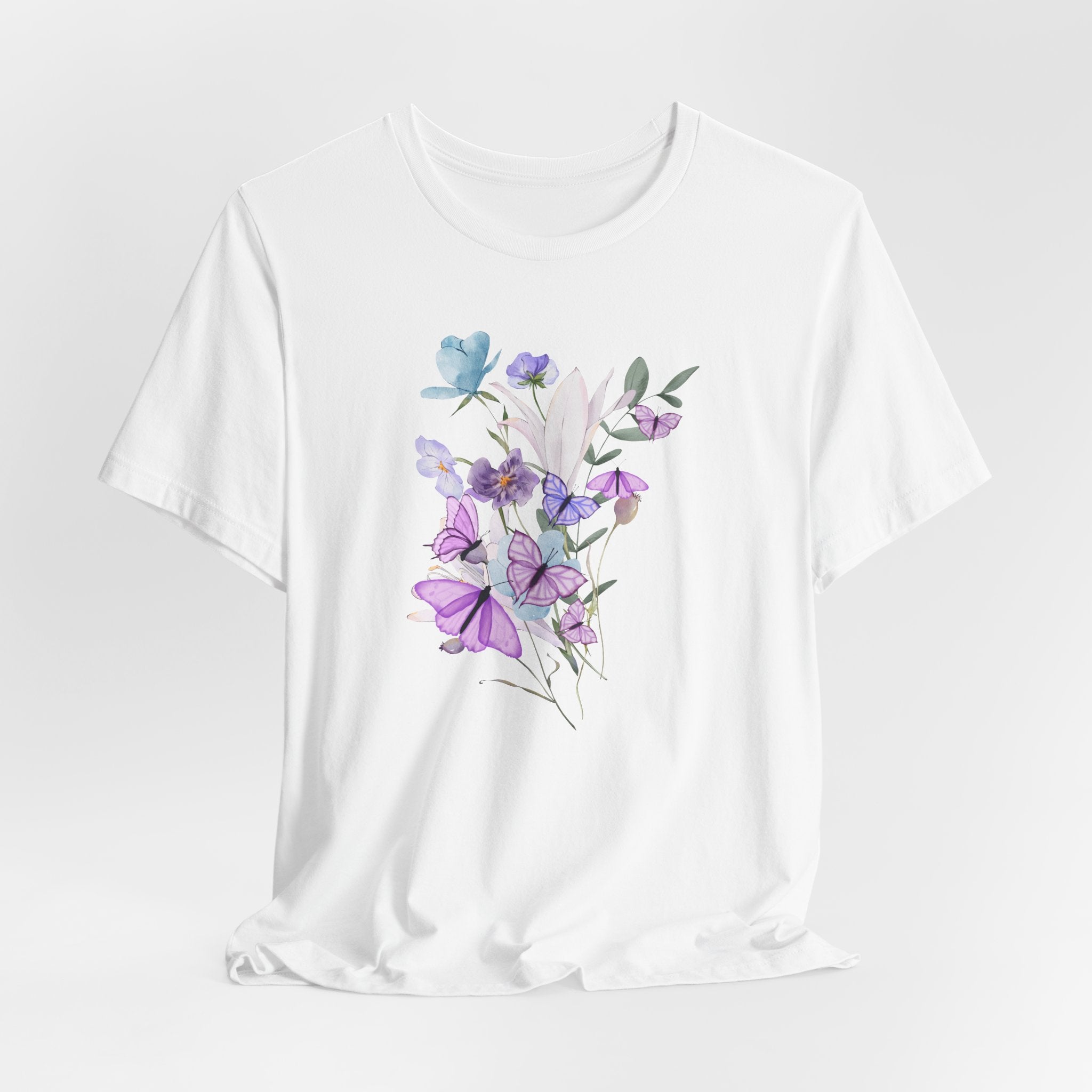 White t-shirt with a floral design on a light gray background
