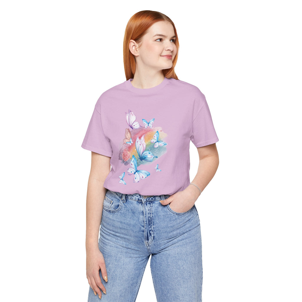 Person wearing a purple t-shirt with butterfly design and blue jeans on a white background