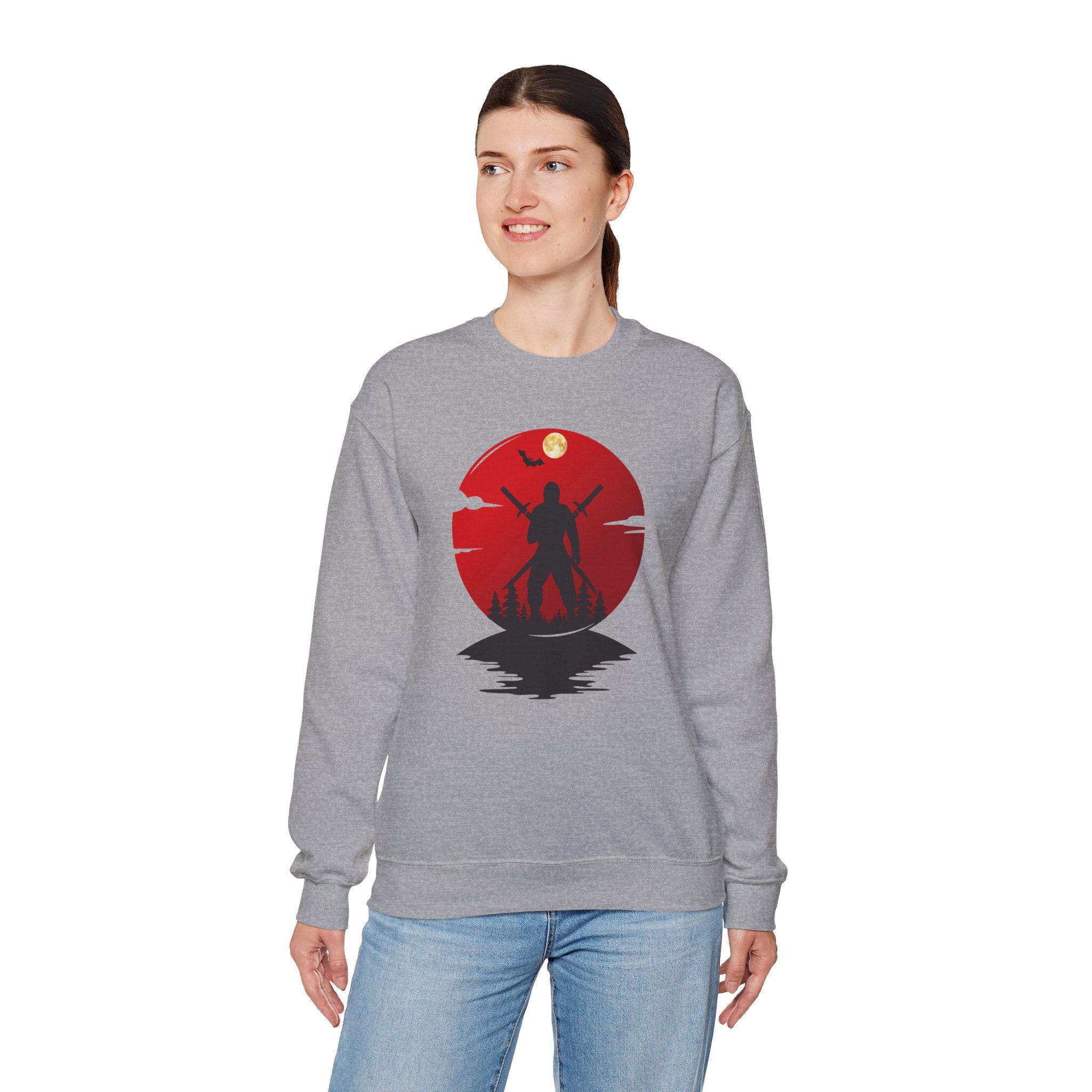 Person wearing a gray sweatshirt with a red and black ninja graphic design on a white background
