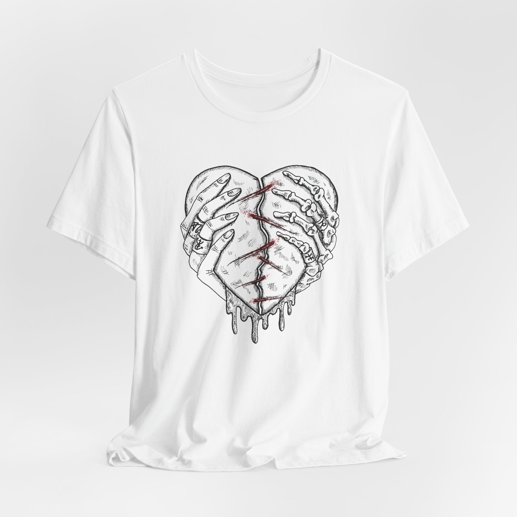 White t-shirt with a graphic of a broken heart design on a white background