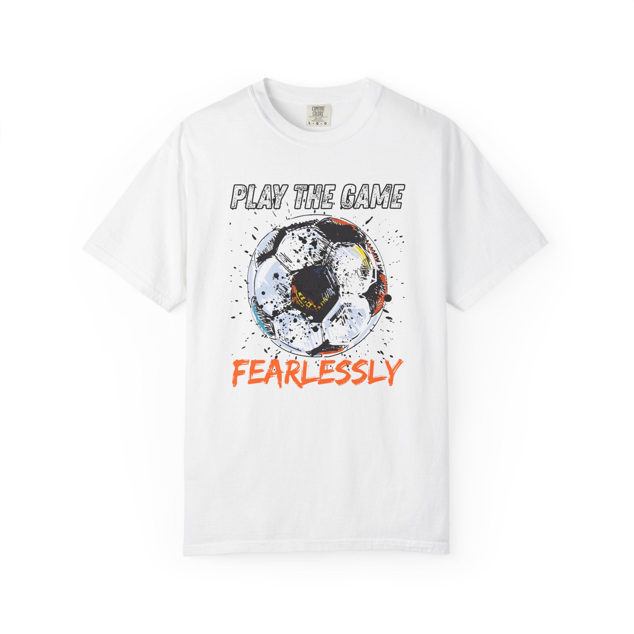 White t-shirt with dirty soccer ball graphic and play the game fearlessly text on a white background