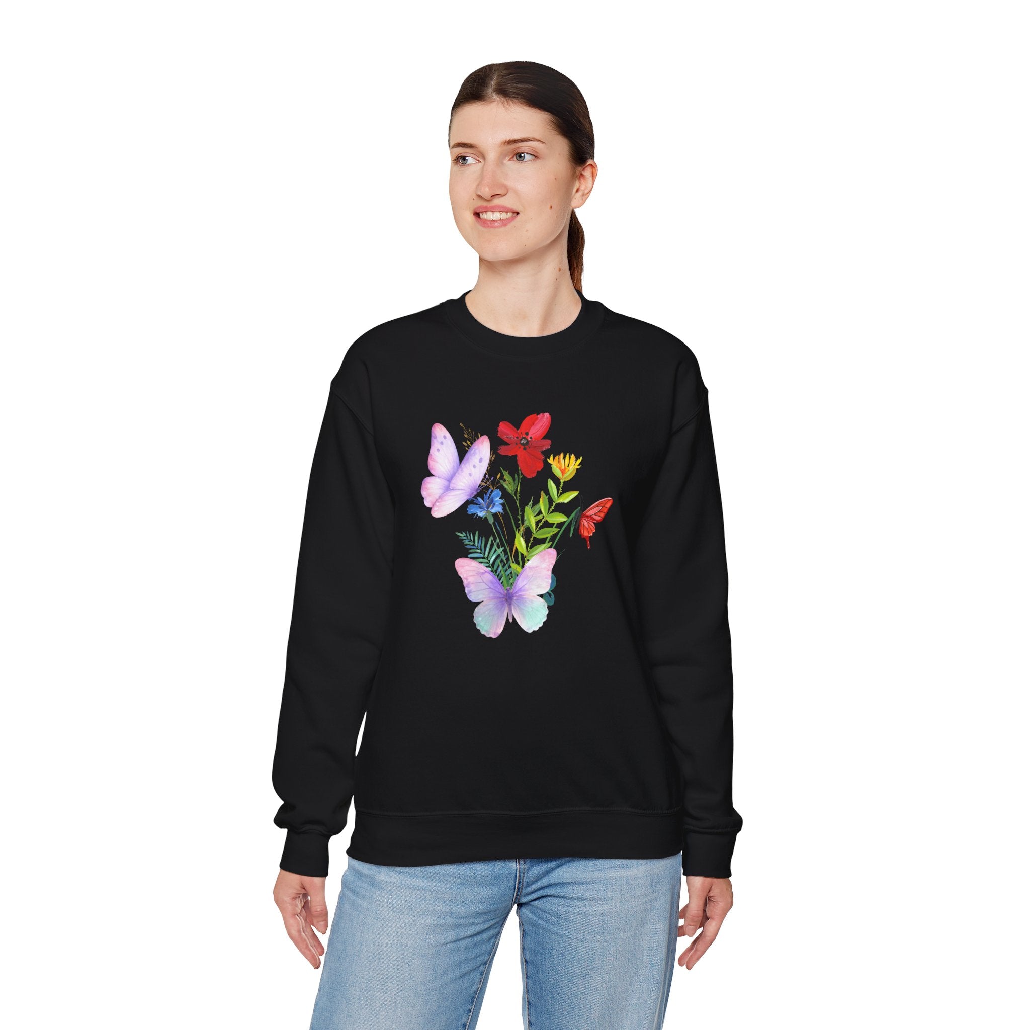Person wearing a black sweatshirt with colorful butterfly design on a white background