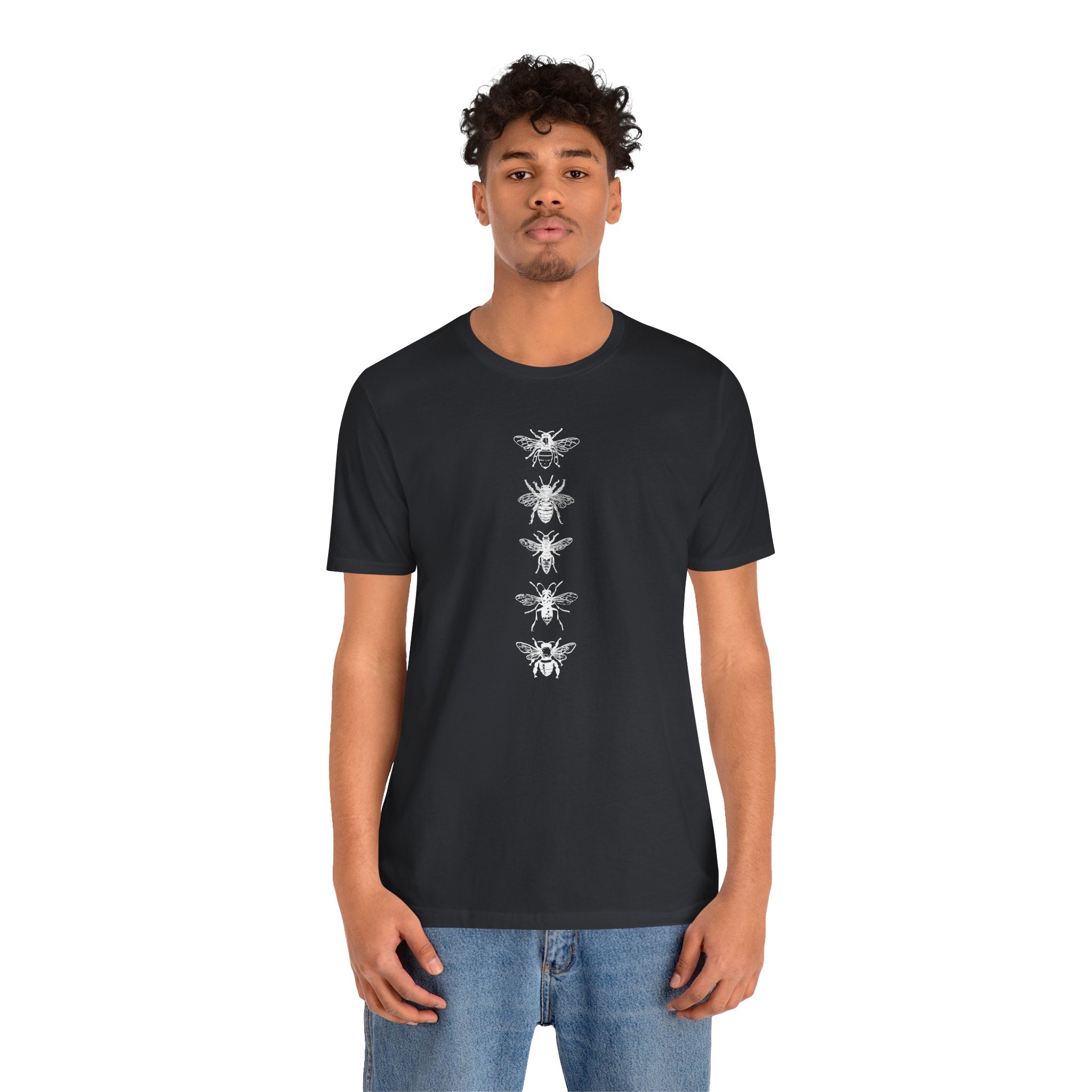 Person wearing a black t-shirt with white graphic design on a white background