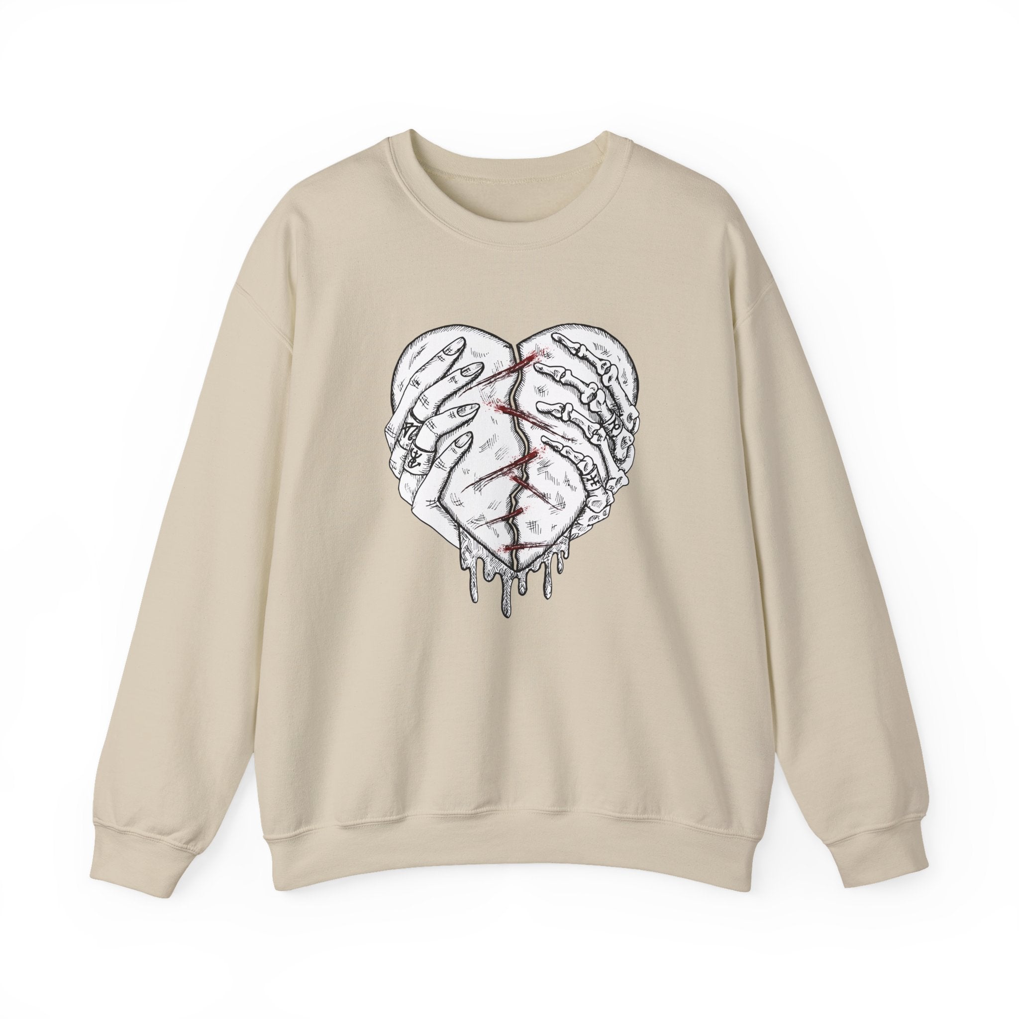 Beige sweatshirt with a graphic design of a broken heart on a white background
