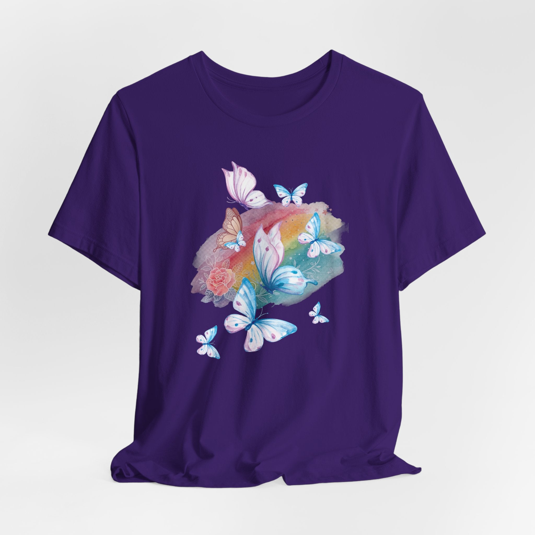 Purple t-shirt with butterfly and flower design on a white background