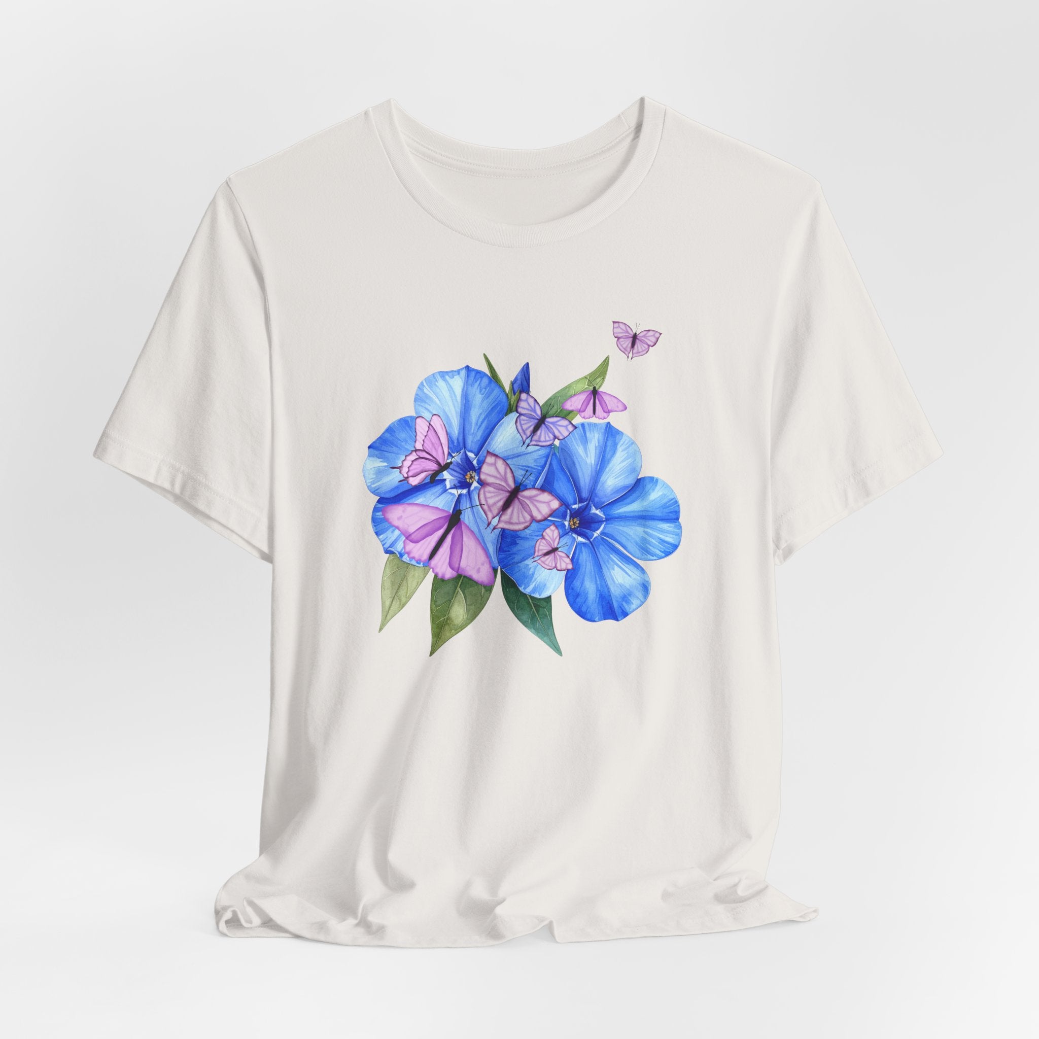 White t-shirt with blue and pink floral design on a white background