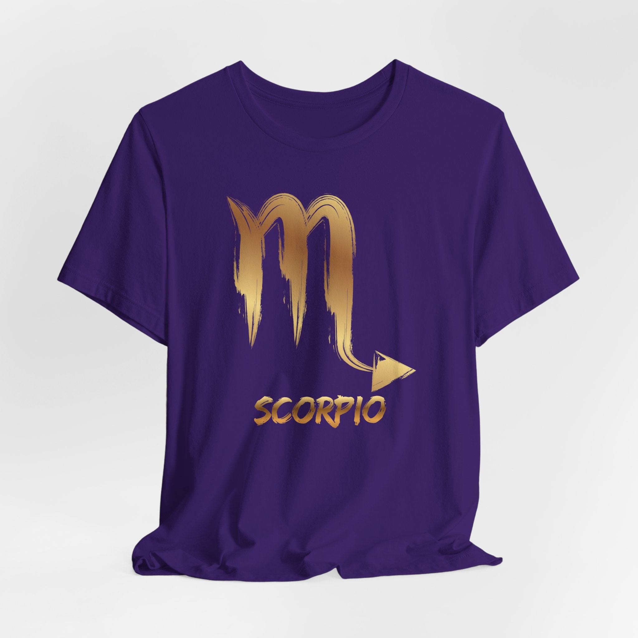 Purple t-shirt with gold Scorpio zodiac symbol on a white background