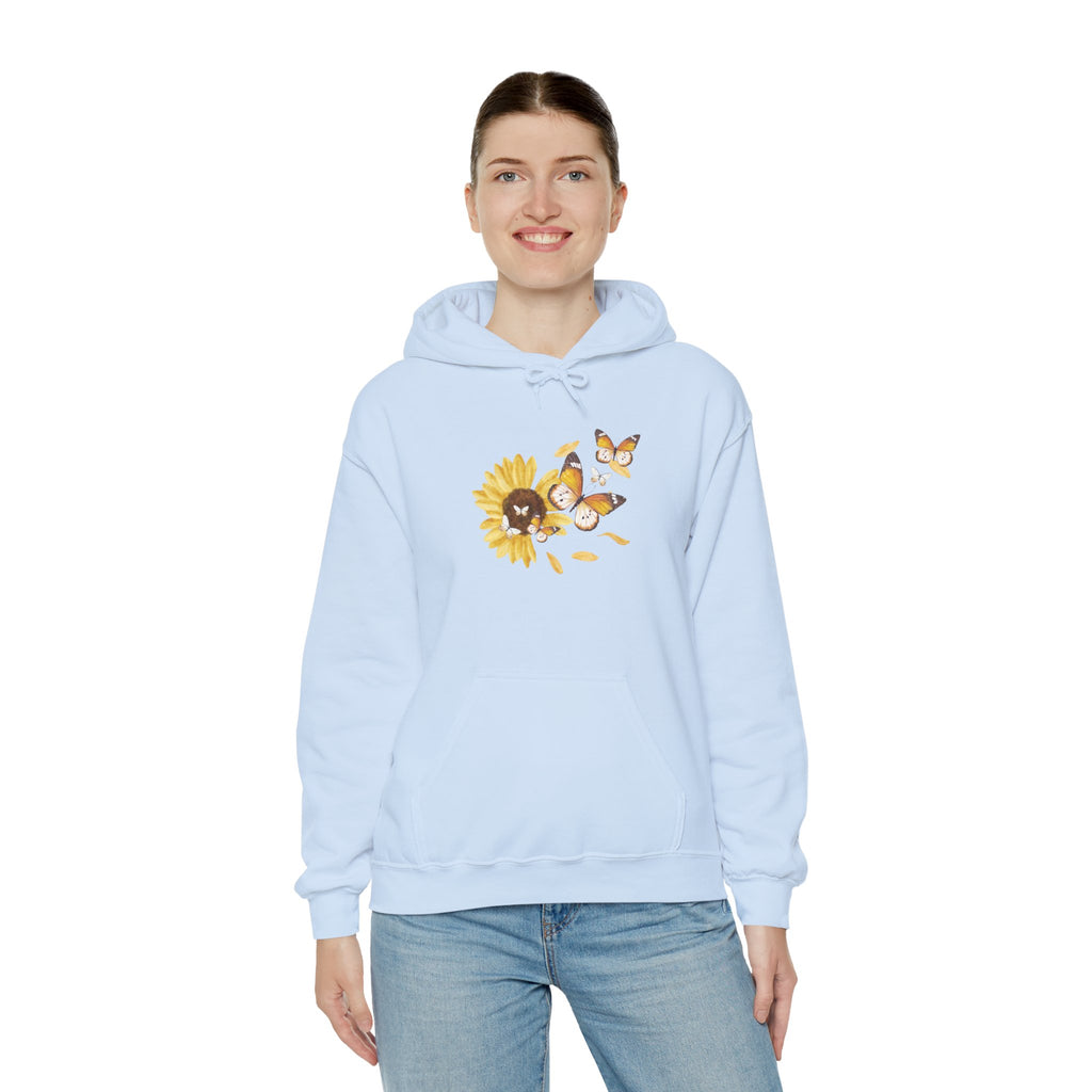 Light blue hoodie with a sunflower and butterfly design worn by a person on a white background