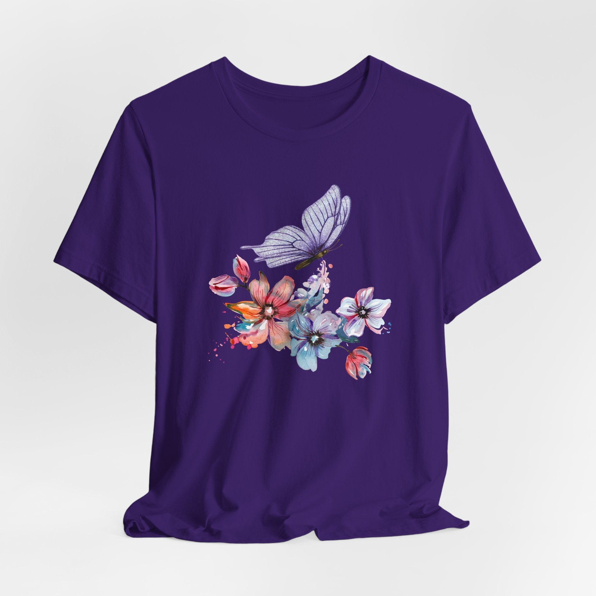 Purple t-shirt with a butterfly and floral design on a white background