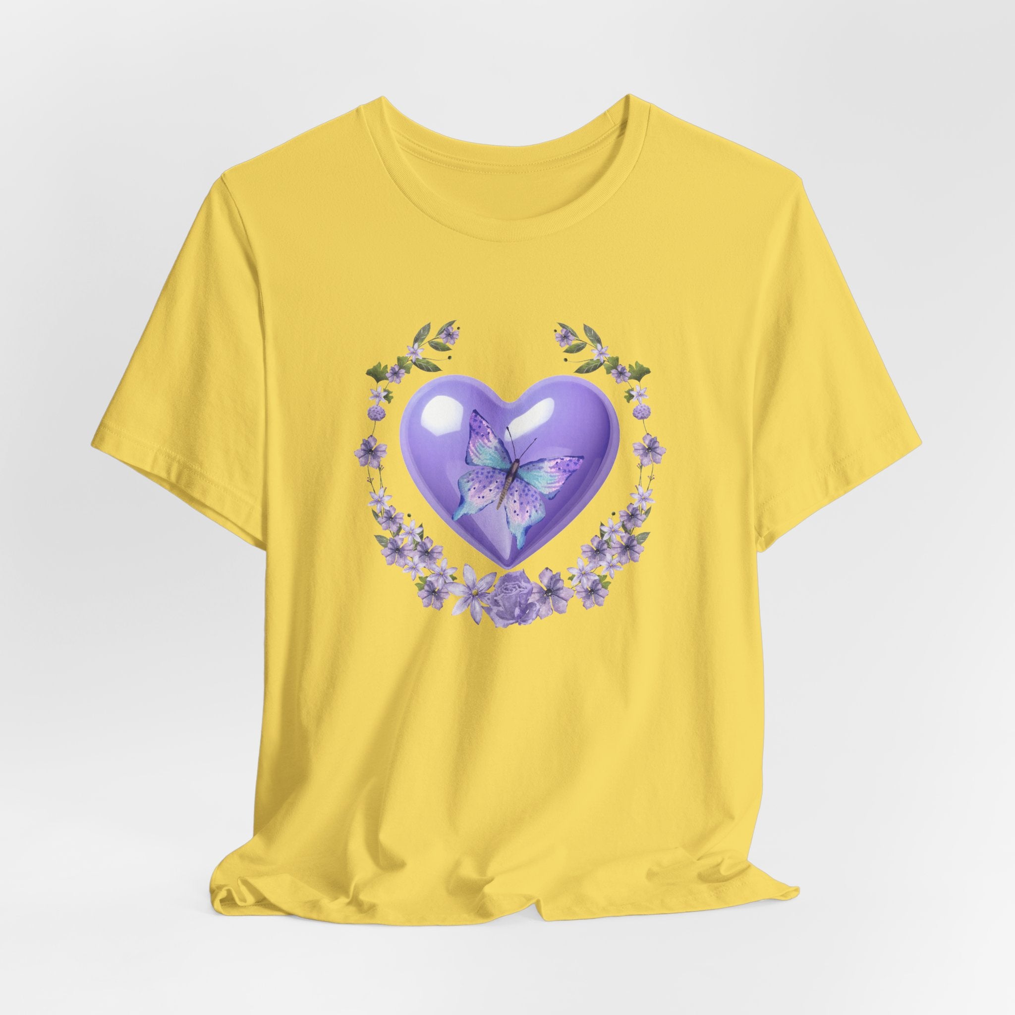Yellow t-shirt with a purple heart and butterfly design on a white background