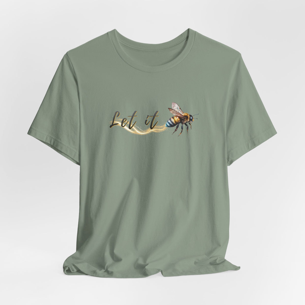 Sage green t-shirt with a bee graphic and 'Let it' text on a white background