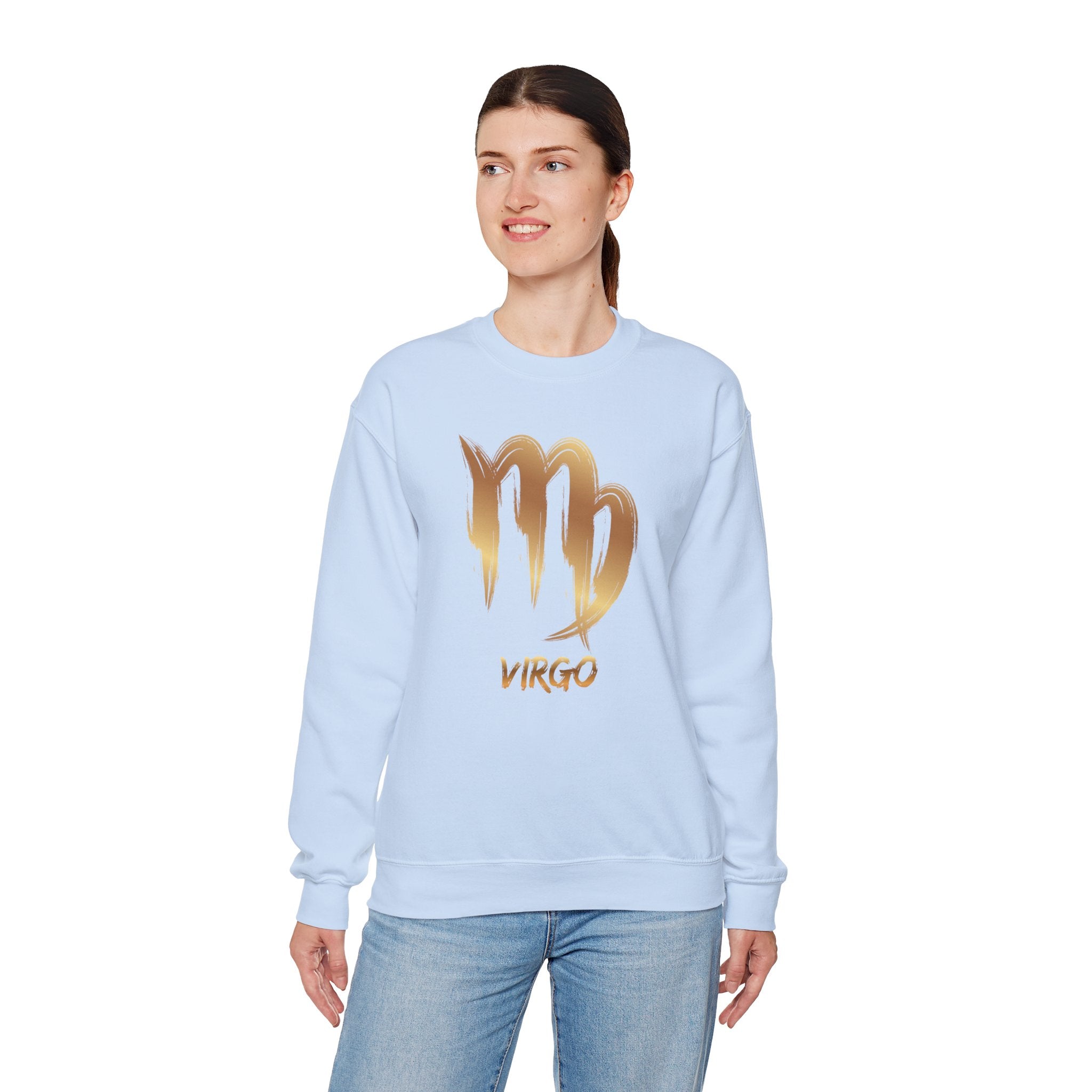 Woman wearing a light blue sweatshirt with 'Virgo' and a gold zodiac sign on a white background