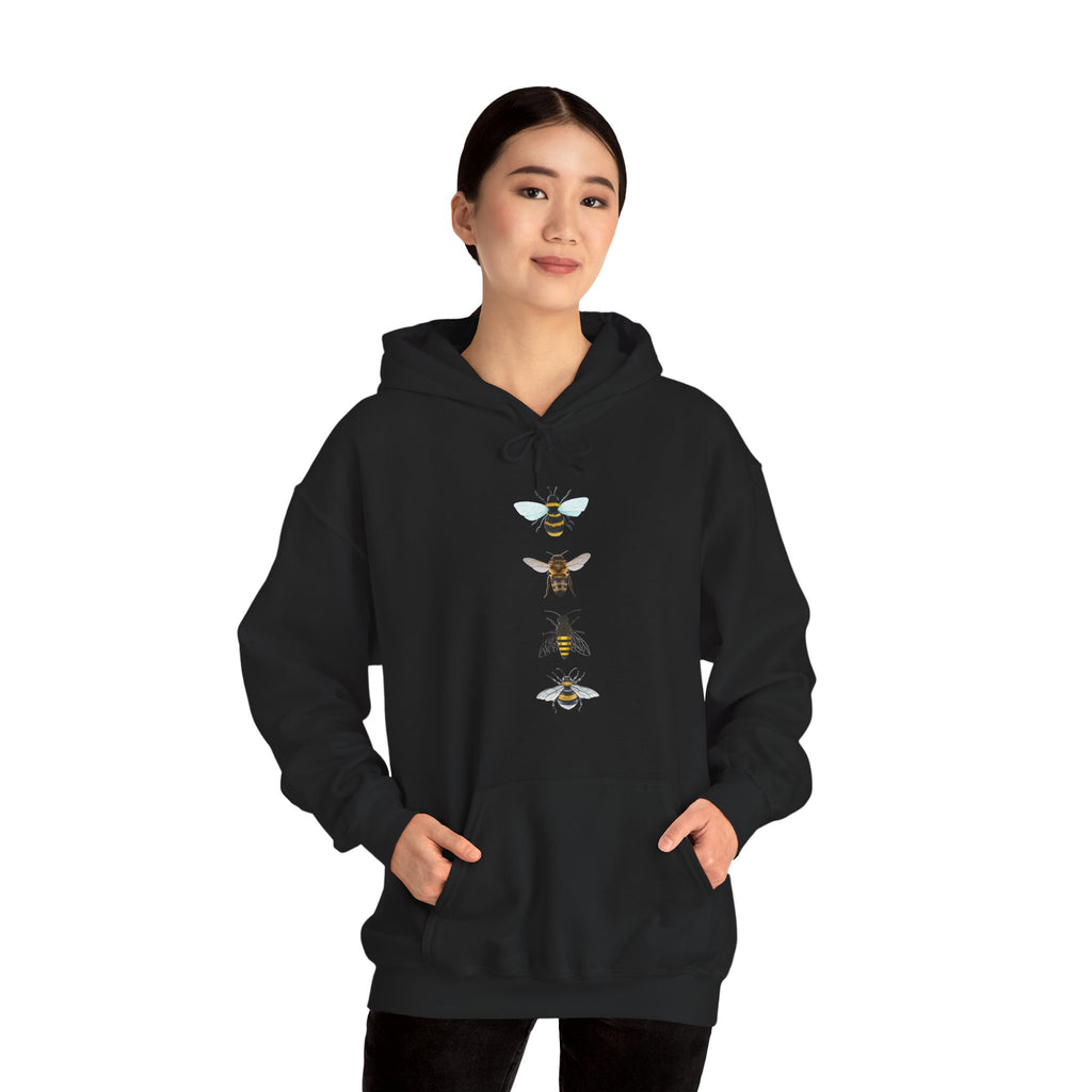 Person wearing a black hoodie with bee graphic on a white background