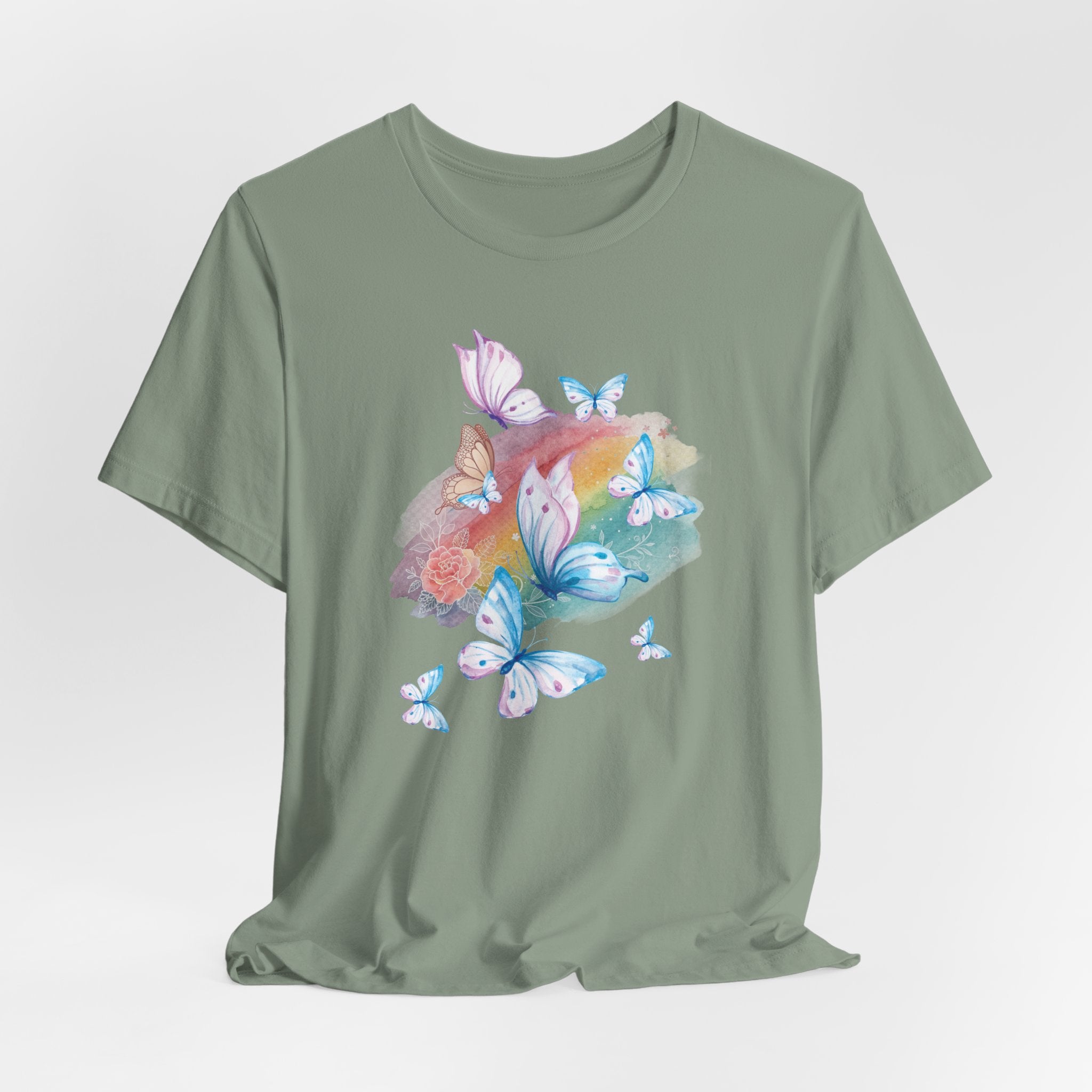 Green t-shirt with colorful butterfly design on a light gray background